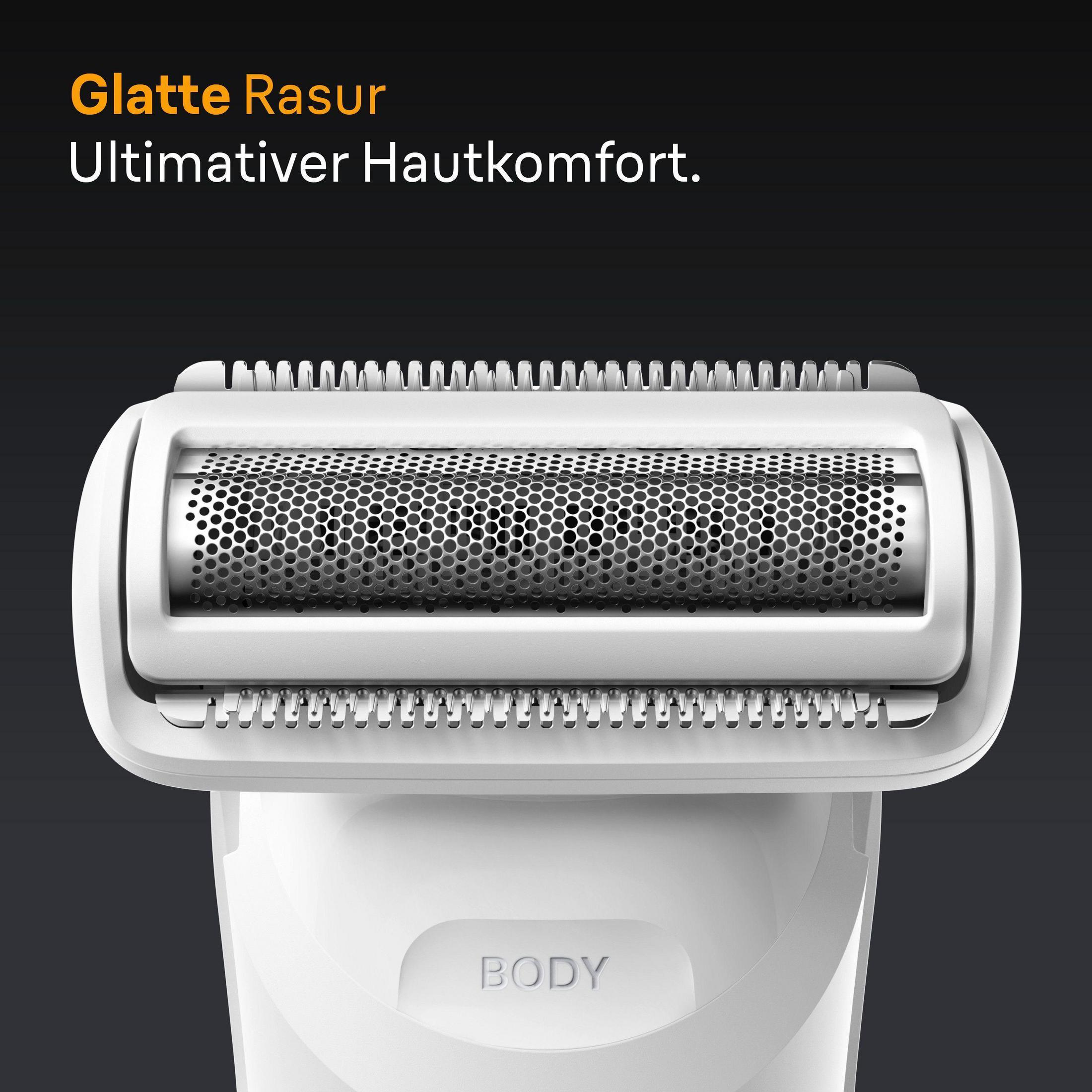 A close-up of a white electric shaver head, showing the blades. The background is dark.