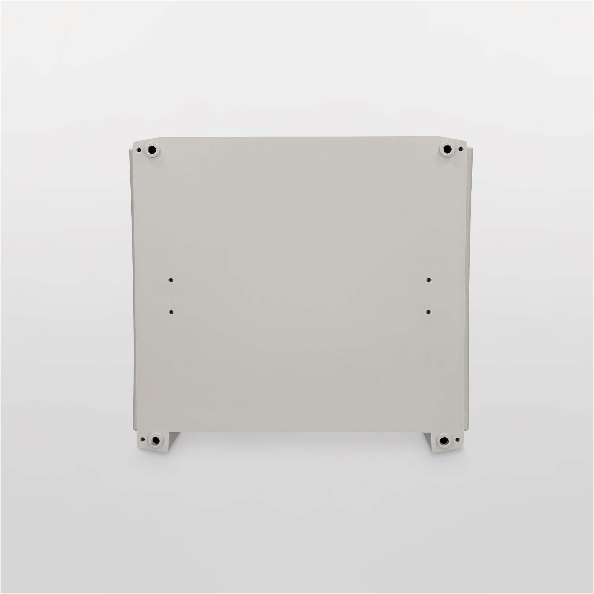 Una caja rectangular gris claro con cuatro patas, vista desde arriba.