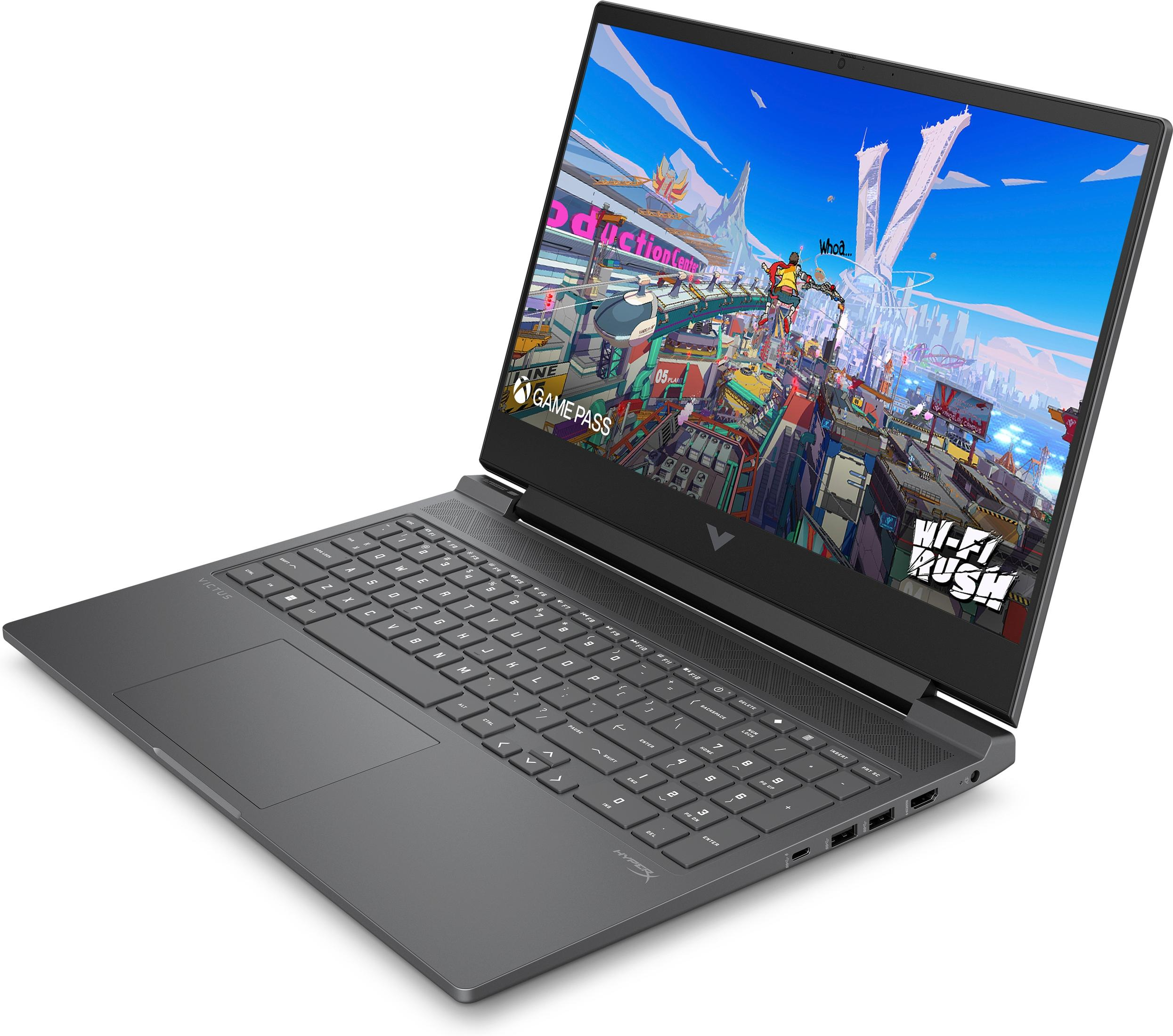 Laptop geöffnet, Spielbildschirm. Dunkelgraue Tastatur und hellgraues Gehäuse.
