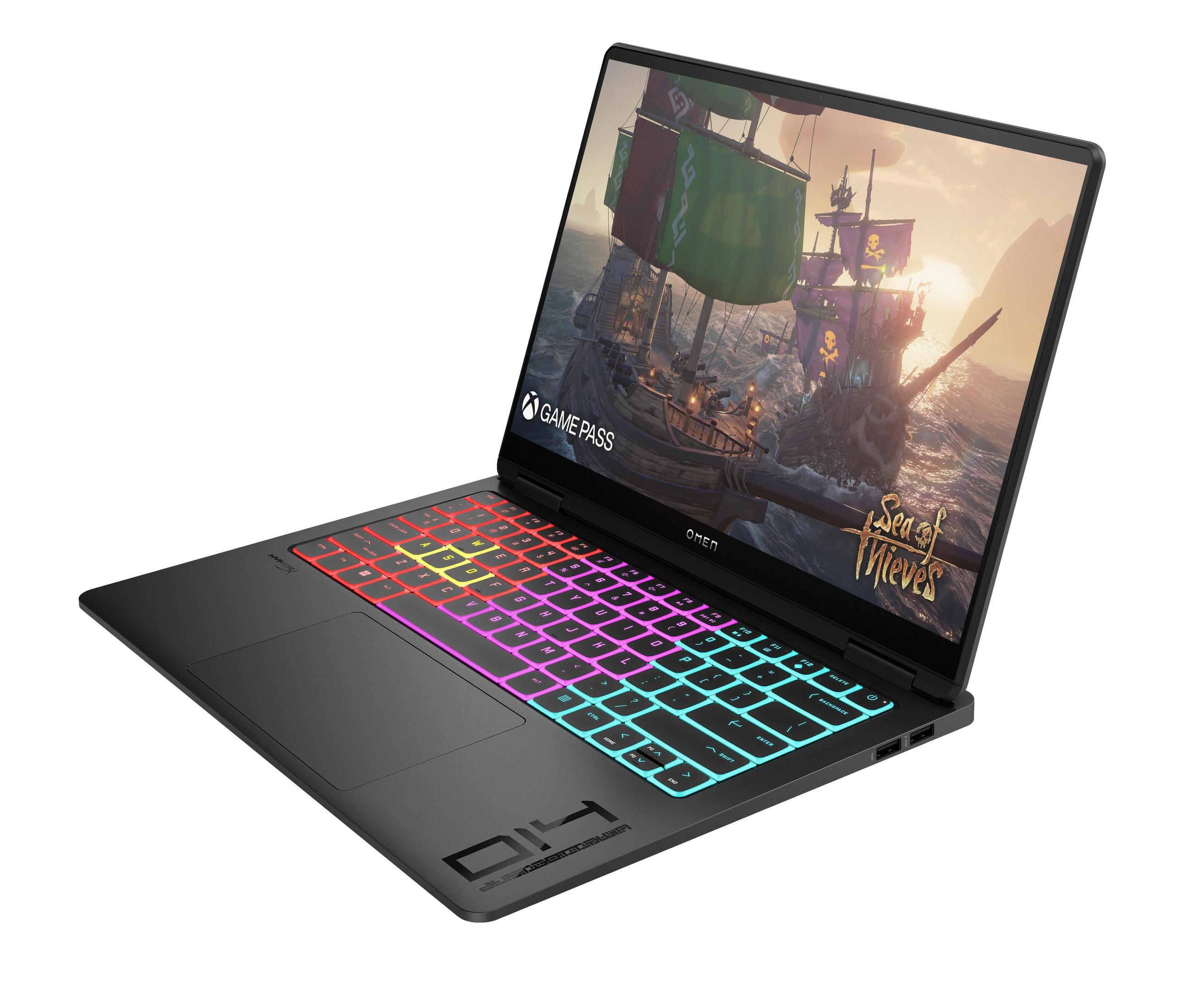 Czarny laptop otwarty pod kątem, wyświetlający scenę z gry Sea of Thieves. Podświetlana klawiatura.