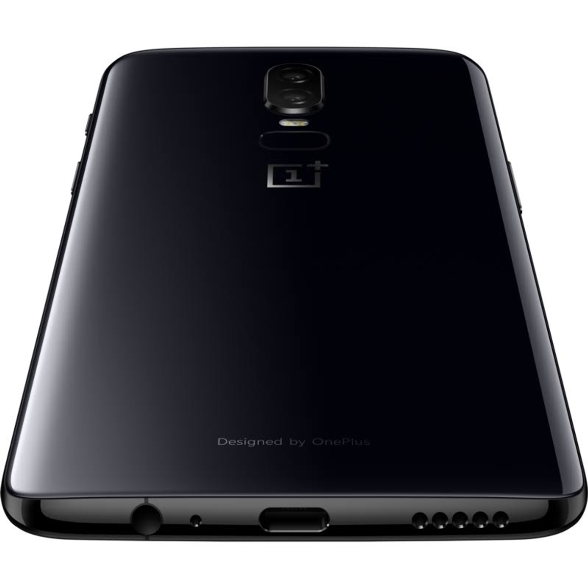 Schwarzes Telefon, Rückansicht, auf weißem Hintergrund.