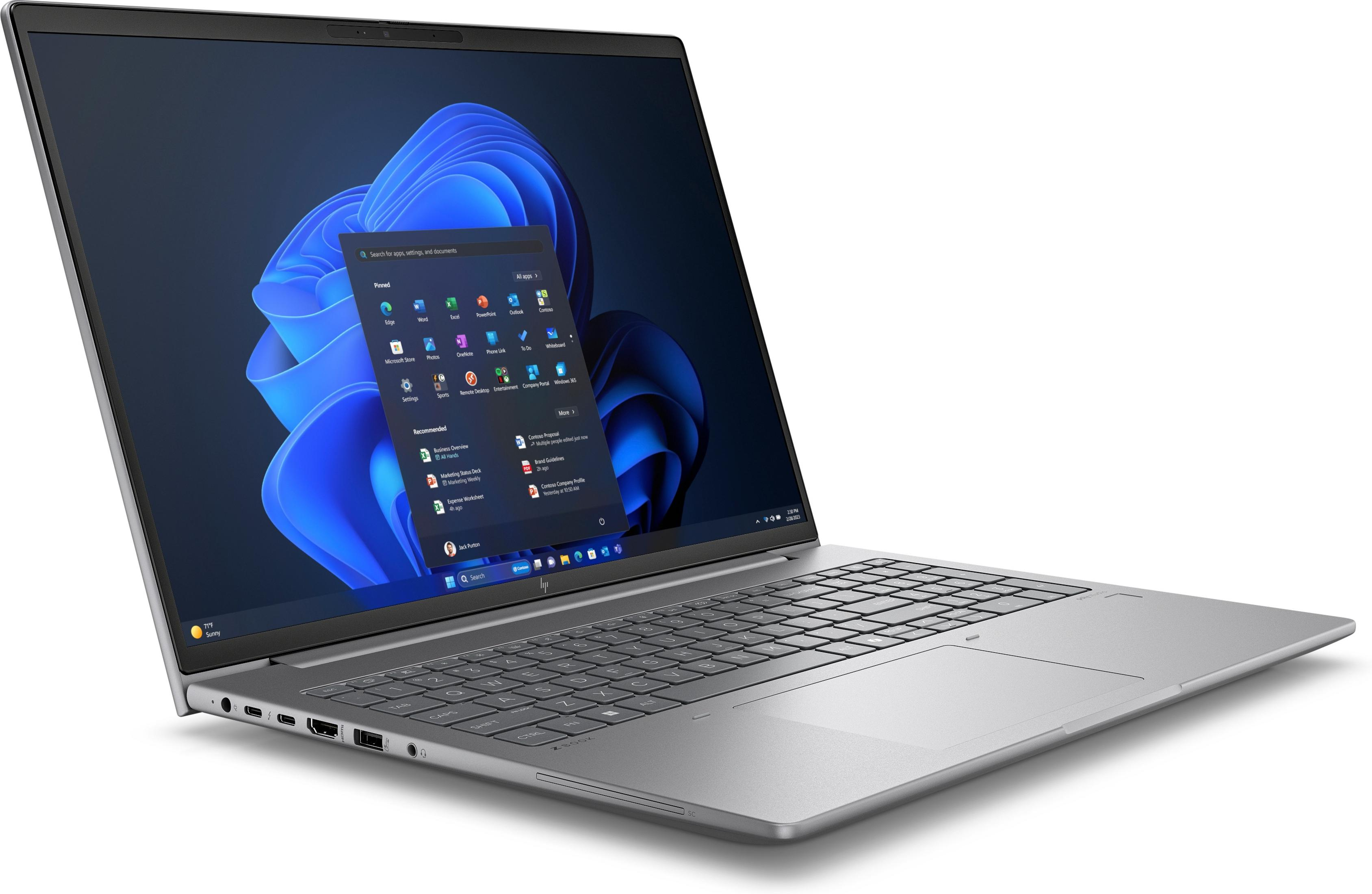Silberner Laptop geöffnet mit Windows 11 Oberfläche.