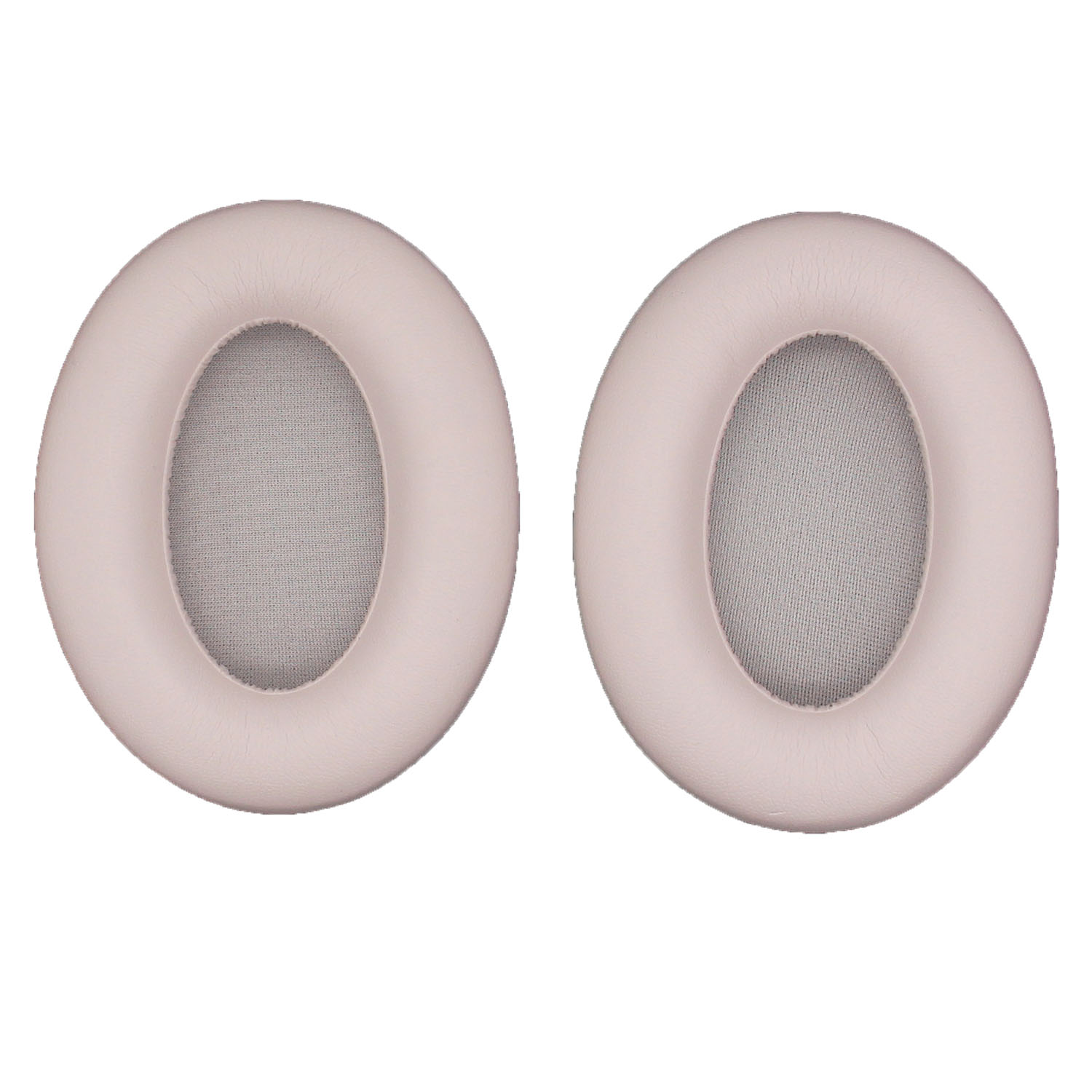 Due cuscinetti auricolari rosa con centro in mesh su sfondo bianco.