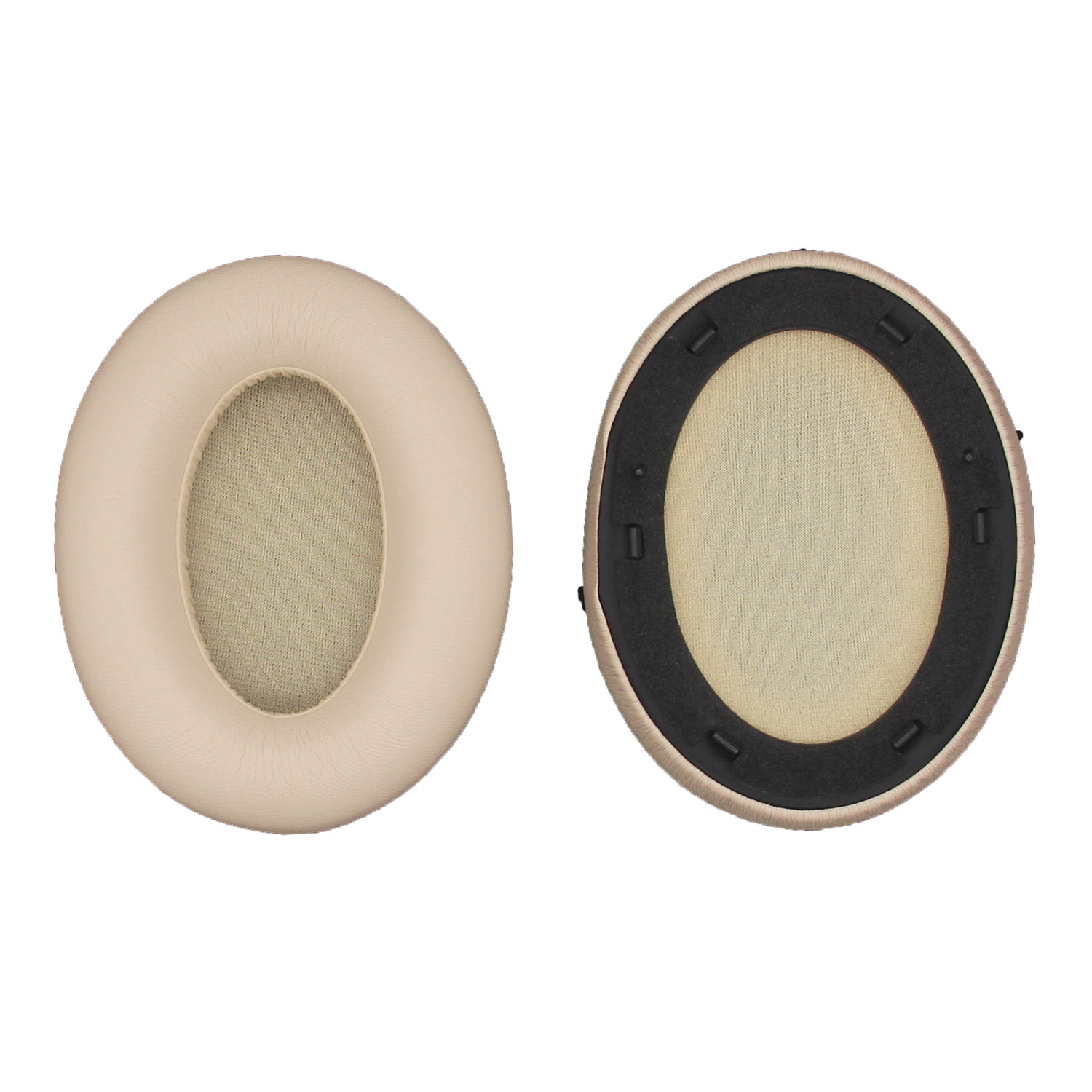 Due cuscinetti auricolari color crema. Uno mostra l'interno con un contorno nero, l'altro la superficie.