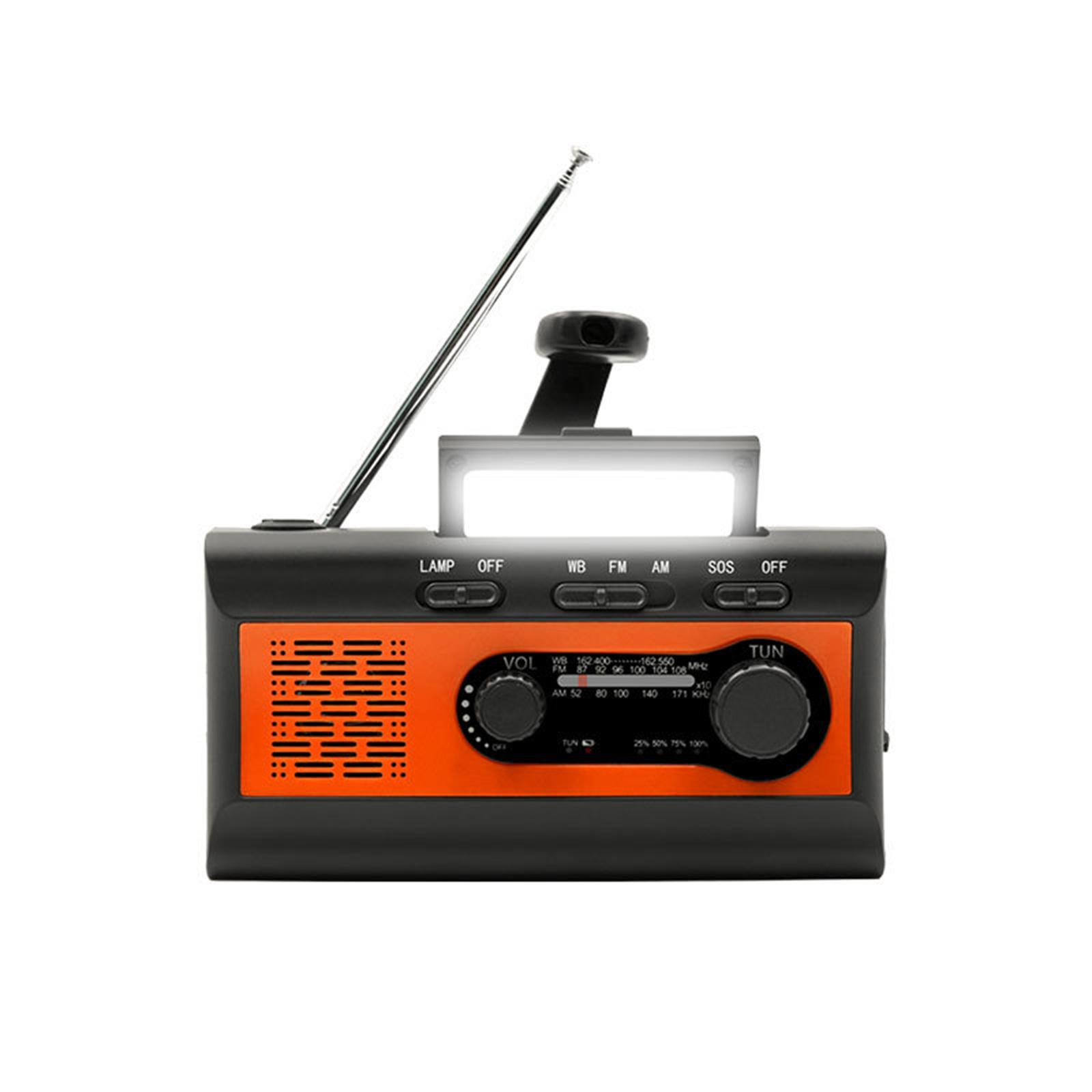 Schwarz-oranges tragbares Radio mit Antenne, Handkurbel und Licht. Knöpfe sind sichtbar.