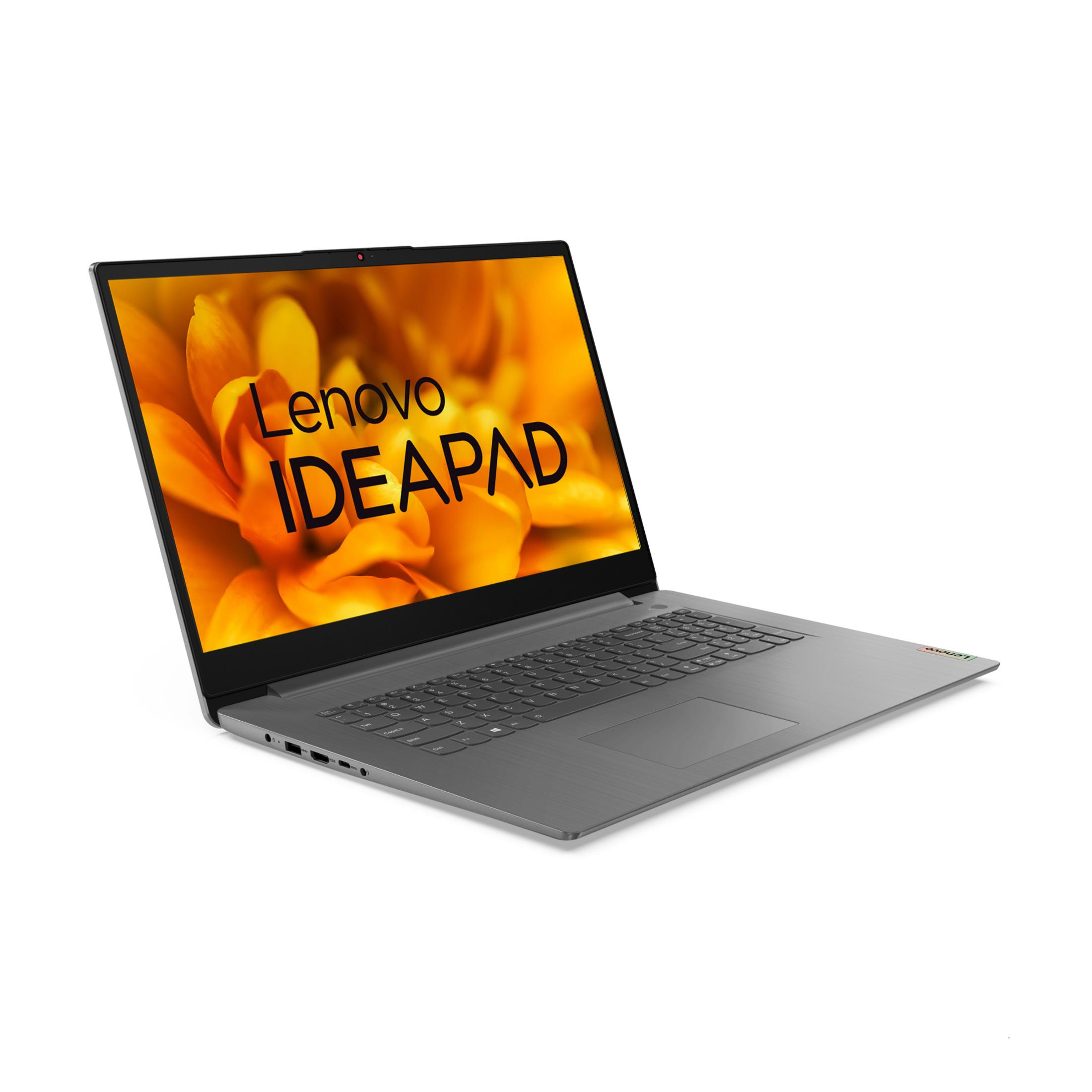 Lenovo IdeaPad na ekranie, pomarańczowe kwiatowe tło, laptop częściowo otwarty.