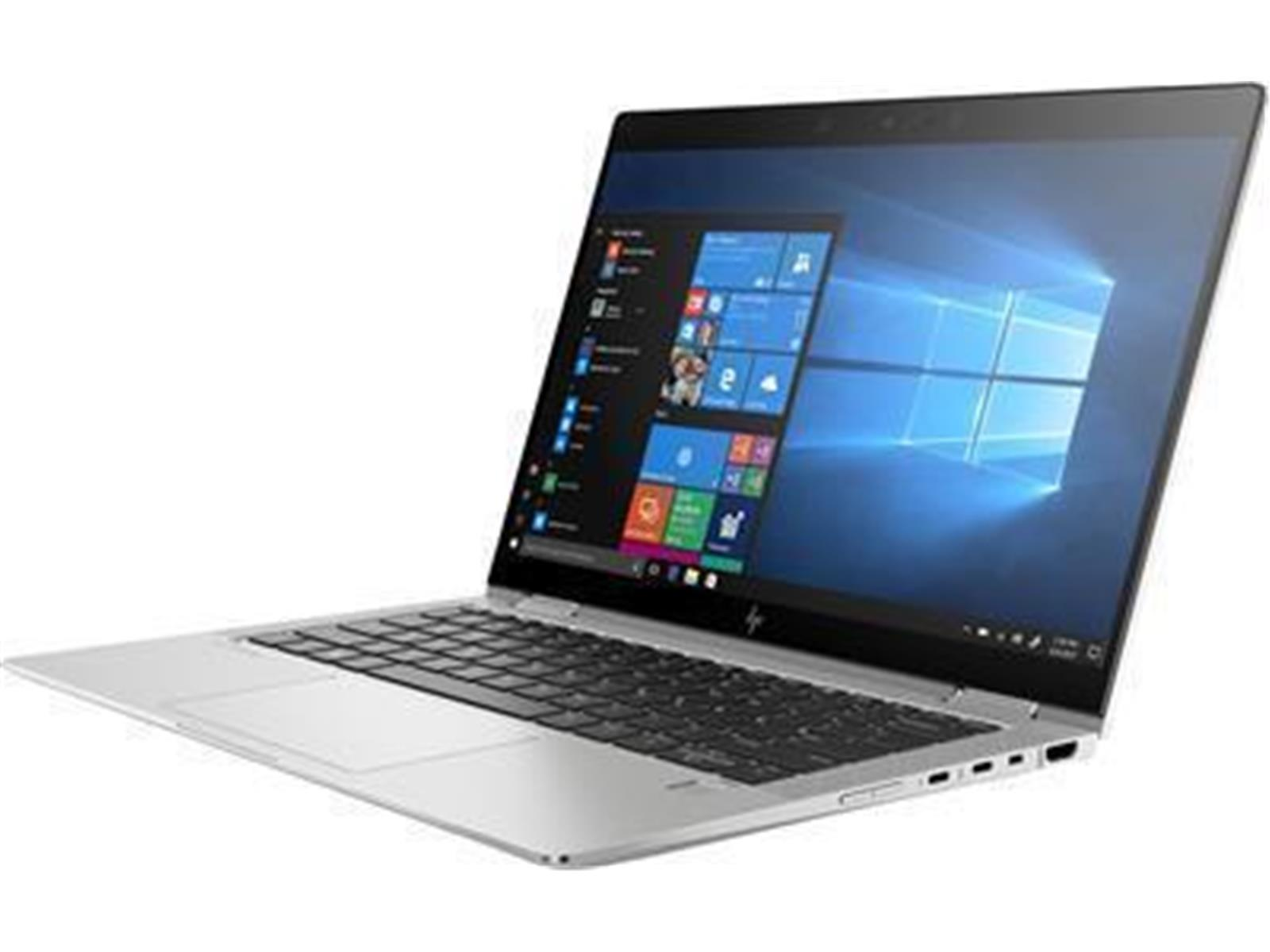 Portátil HP plateado con interfaz Windows. La pantalla está abierta, mostrando el escritorio. El logo es HP.