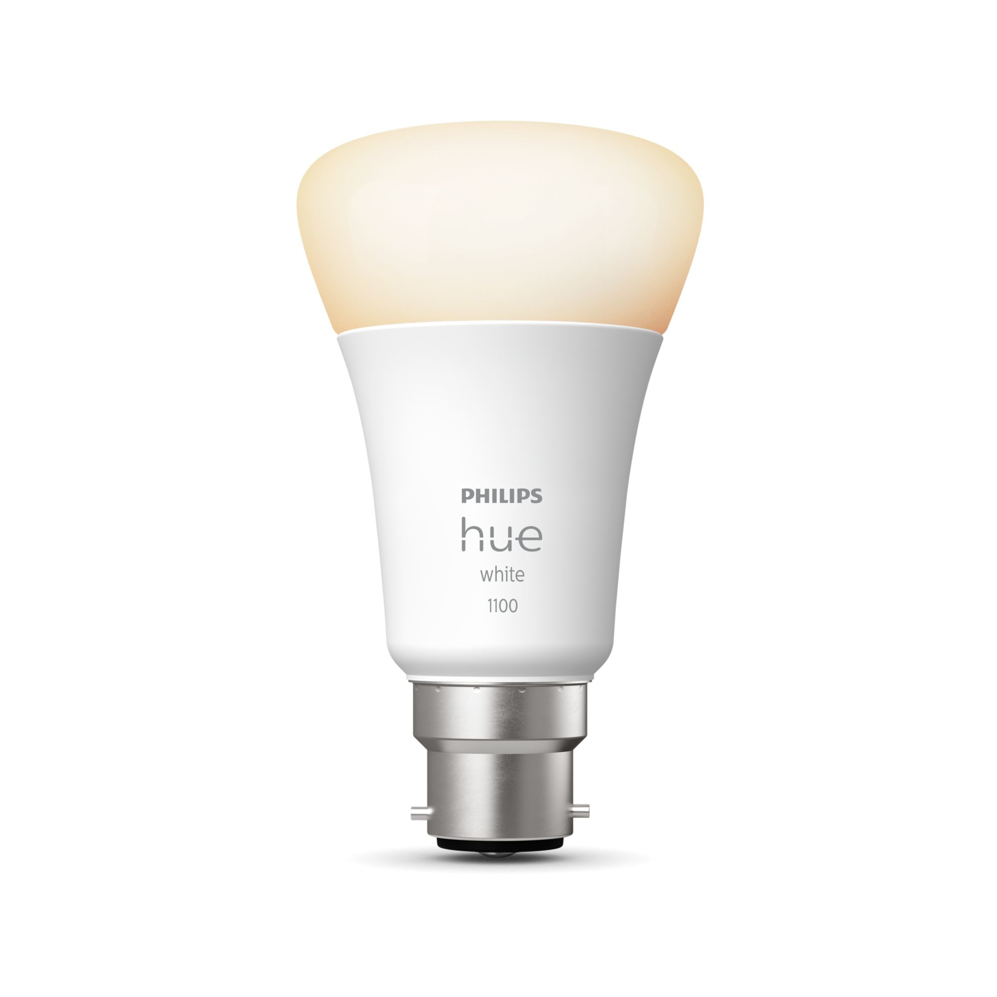 Lampadina intelligente Philips Hue bianca su sfondo bianco, accesa e luminosa.