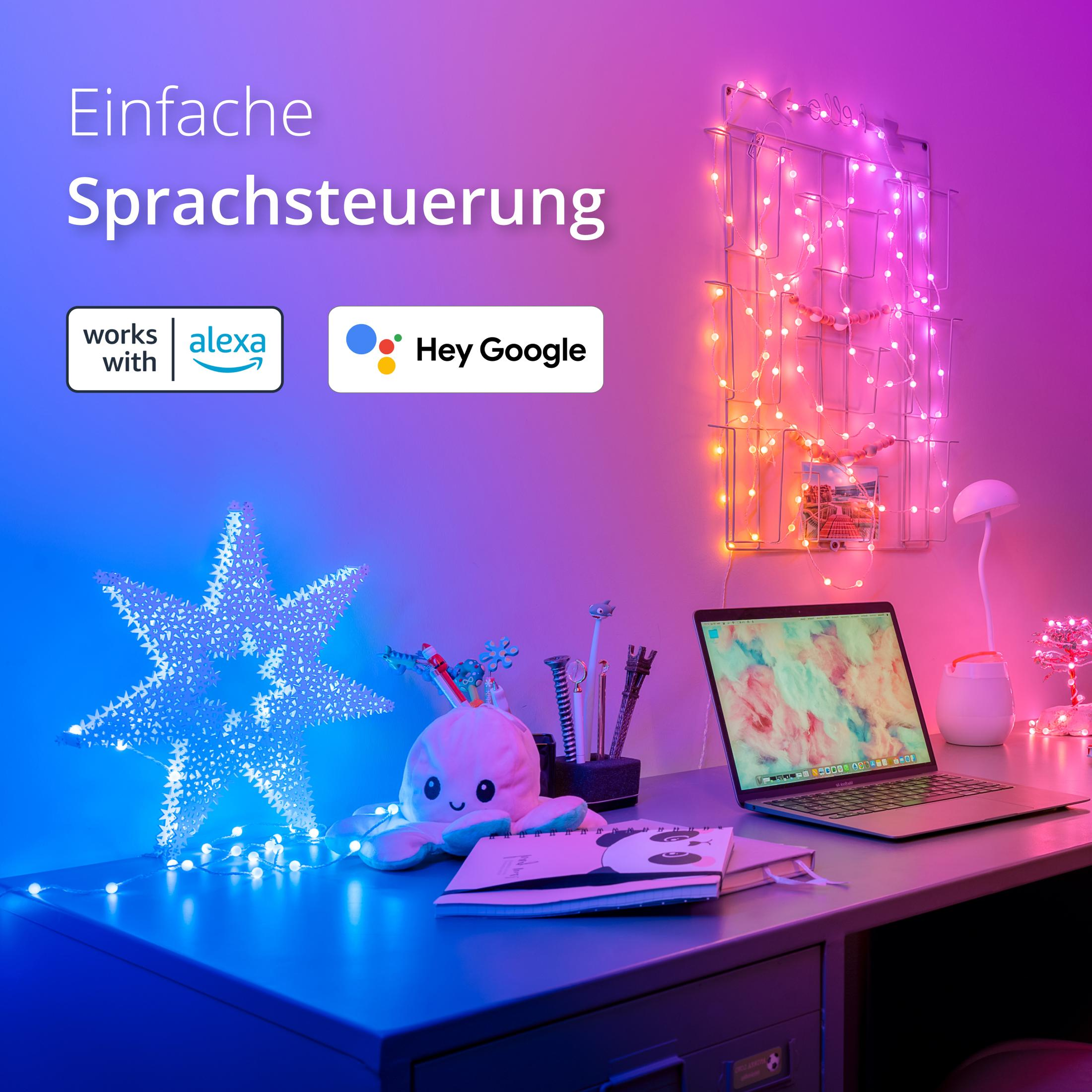 Biurko z laptopem, światłem w kształcie gwiazdy i notatnikiem. Światła w tle.