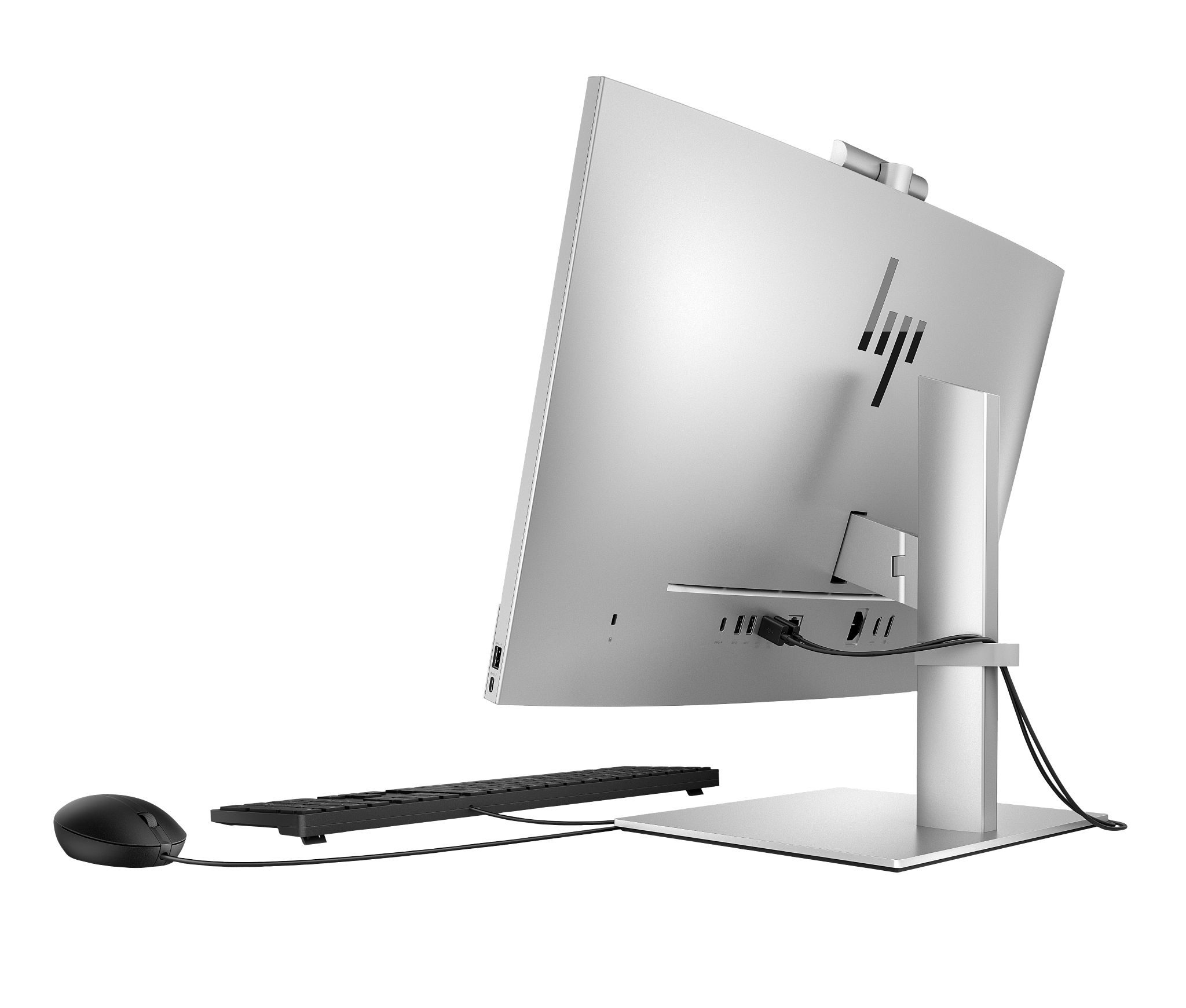 Vista posteriore di un PC HP all-in-one argento e nero con tastiera e mouse neri.
