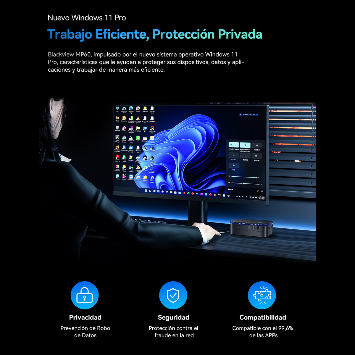 Mujer con monitor mostrando info Windows 11 Pro. Ordenador negro e iconos abajo.
