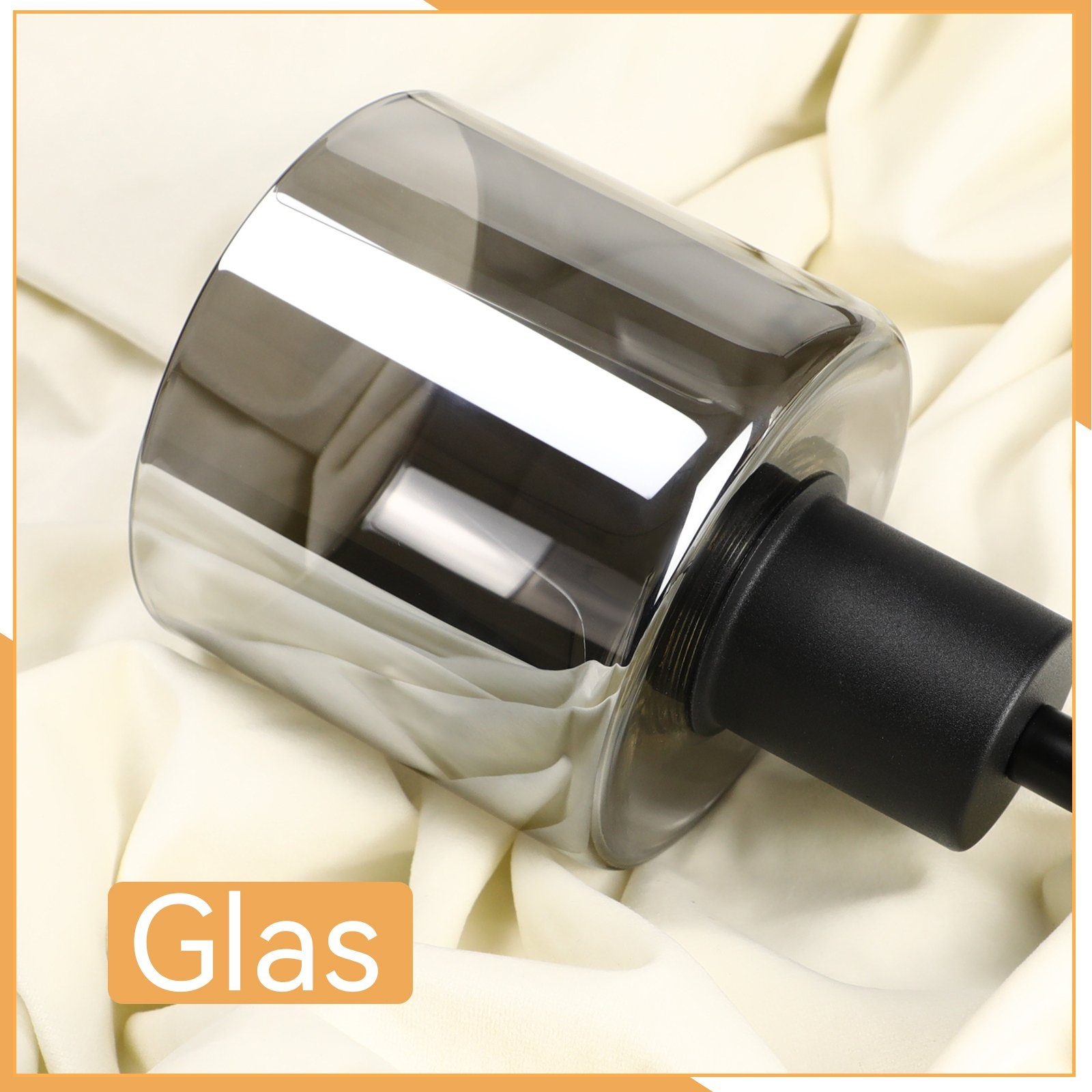 Una lampada in vetro con paralume grigio scuro e collo nero. Viene visualizzata la parola "Glas".