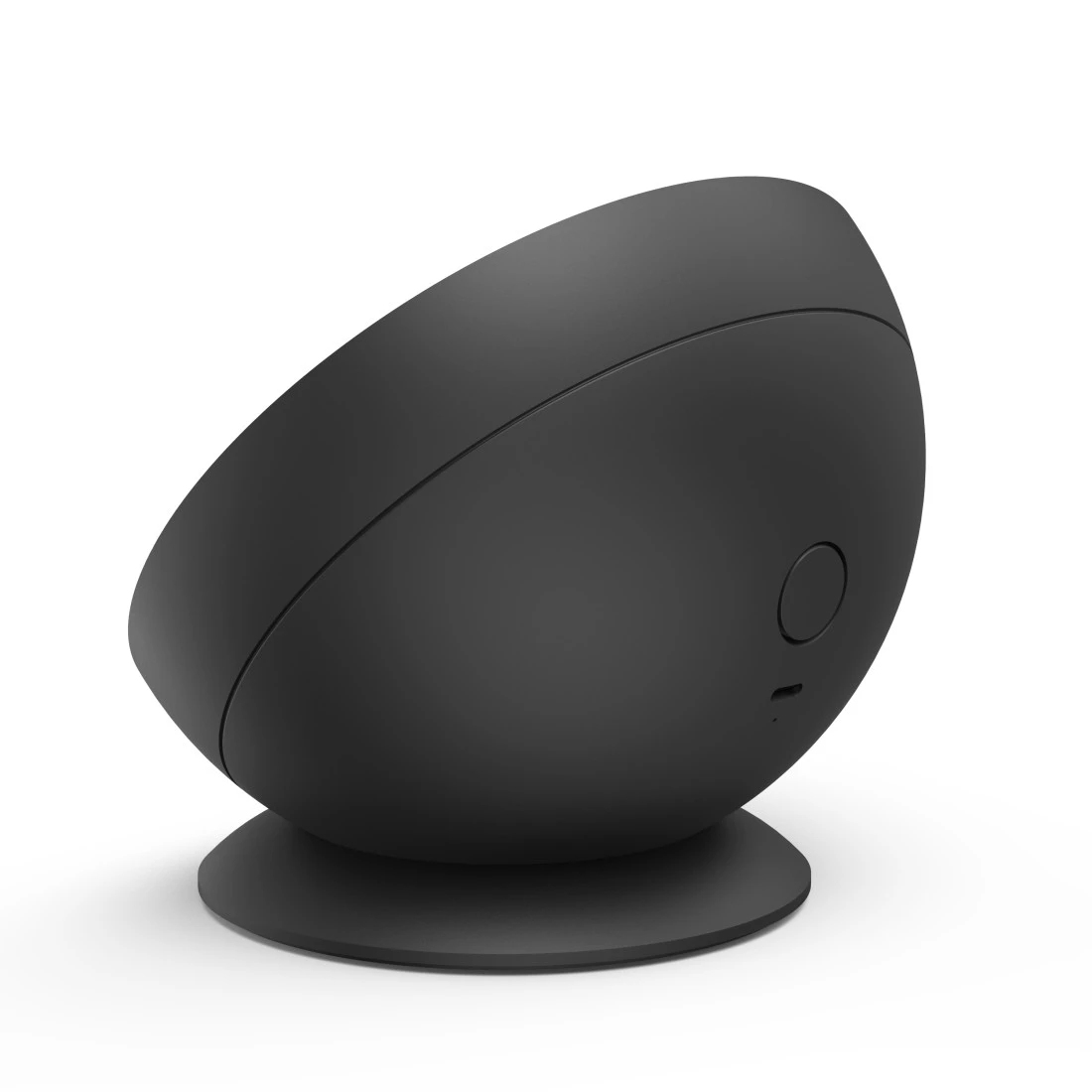 Czarny, zaokrąglony, jajowaty obiekt na czarnej podstawie. Widoczny mały przycisk.