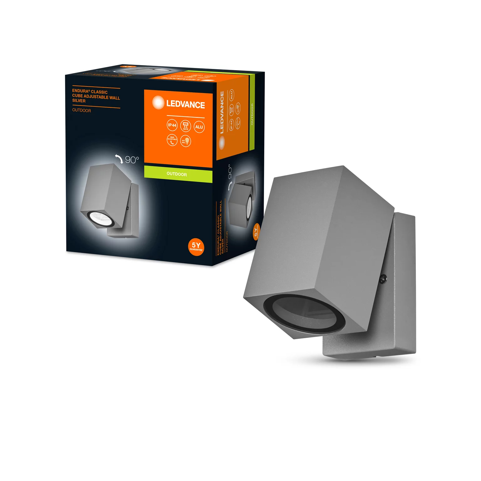 Eine graue Lampe und eine Box stehen auf einer weißen Oberfläche.