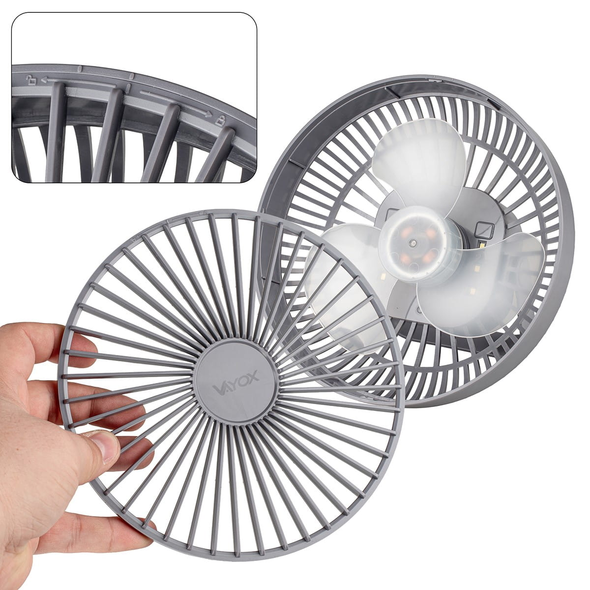 Zbliżenie rozebranego wentylatora biurkowego, ukazujące łopaty i kratkę ochronną.