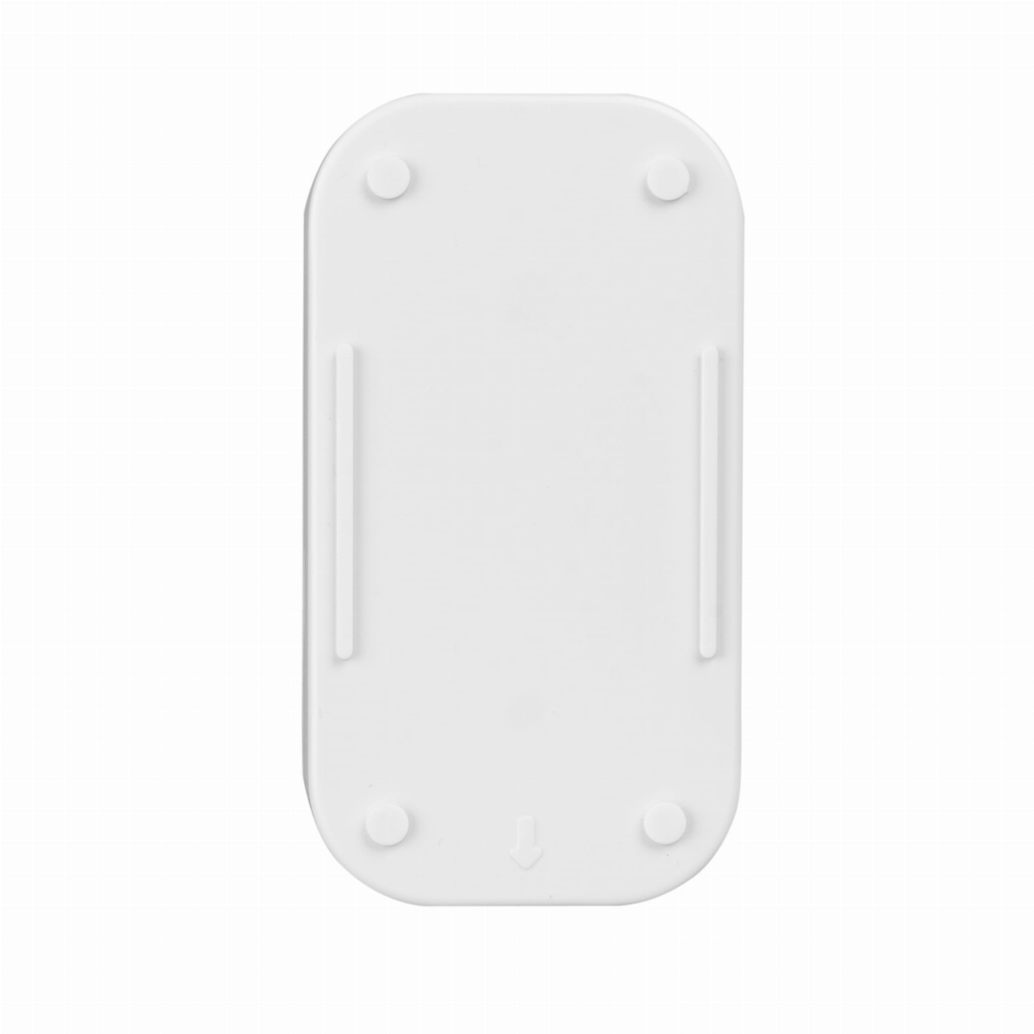 Widok od spodu białego urządzenia o prostokątnym kształcie i czterech małych, okrągłych nóżkach.