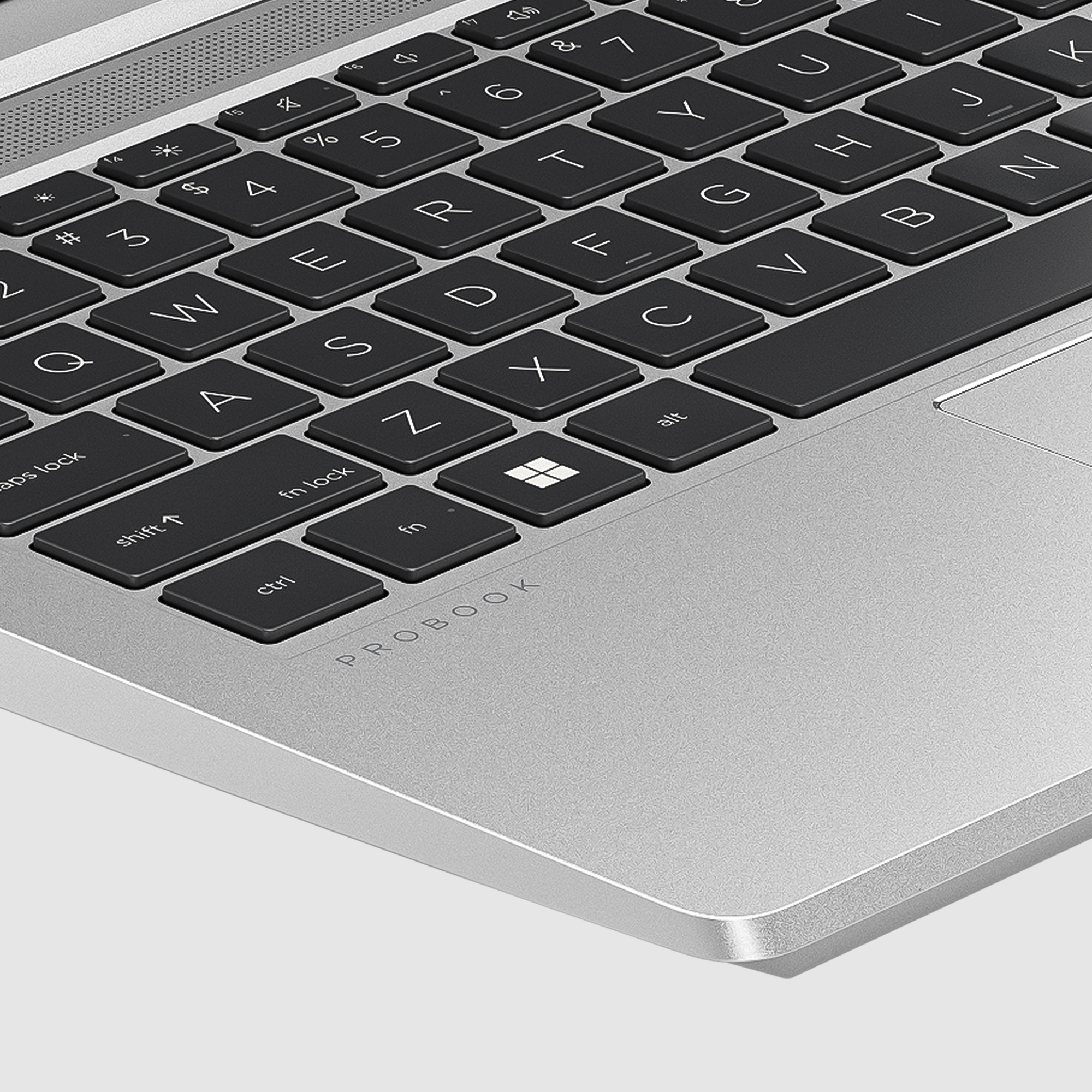 Primo piano della tastiera di un laptop argentato, che mostra il logo ProBook.
