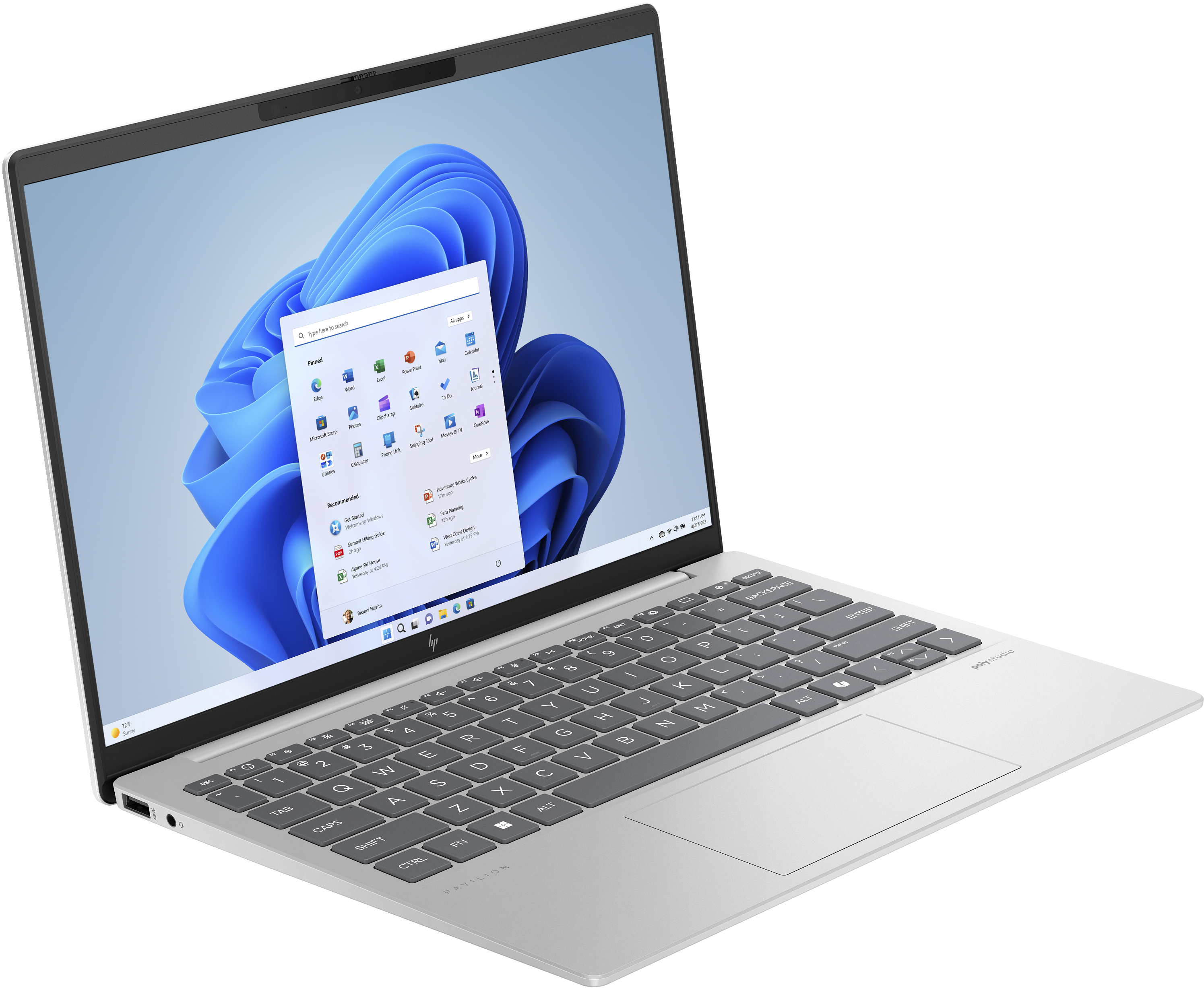 Silver laptop open on a white surface. The screen displays a Windows 11 interface with blue abstract background.