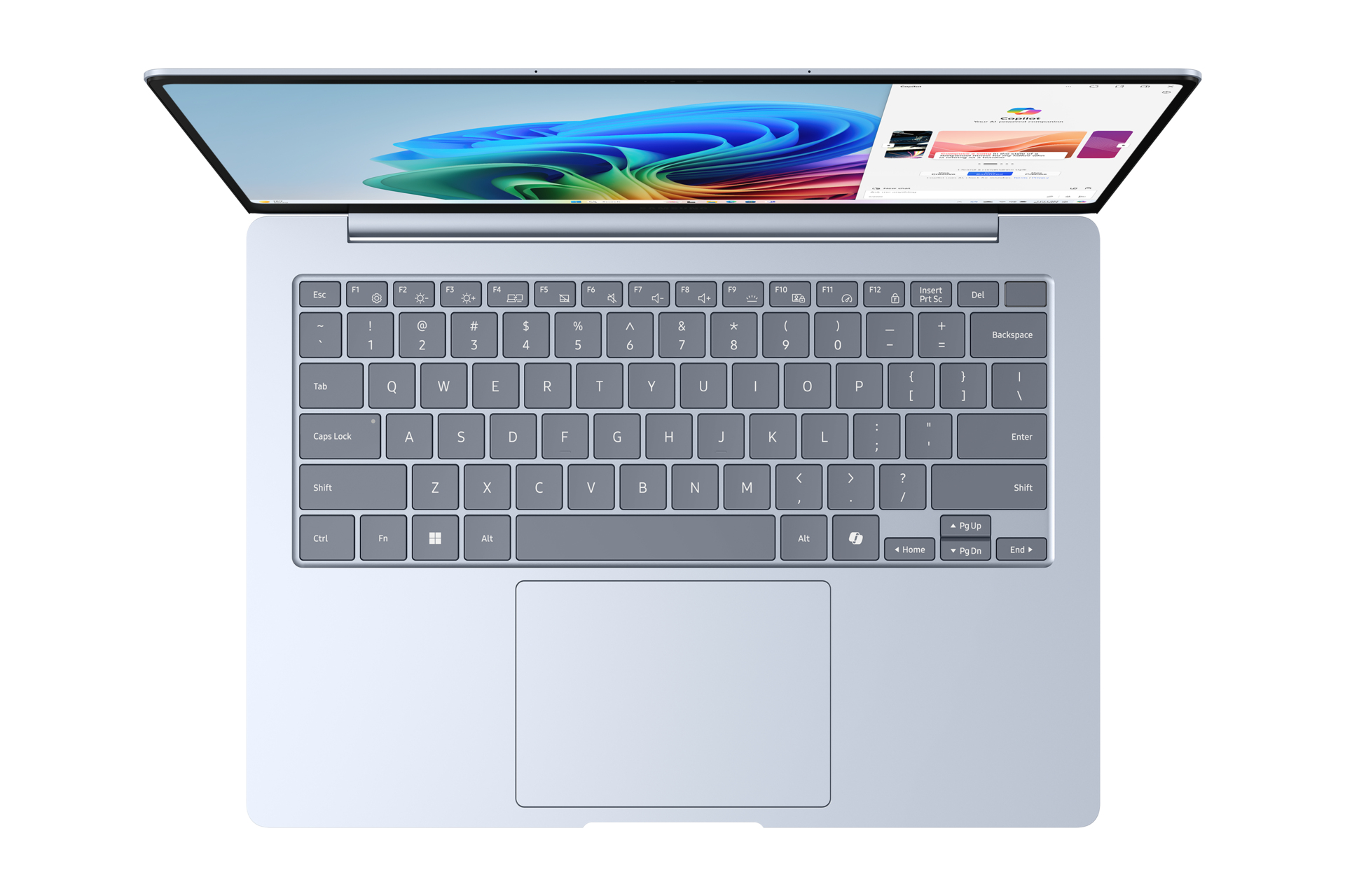 Laptop, top view, keyboard and screen visible. Screen shows colorful abstract design.