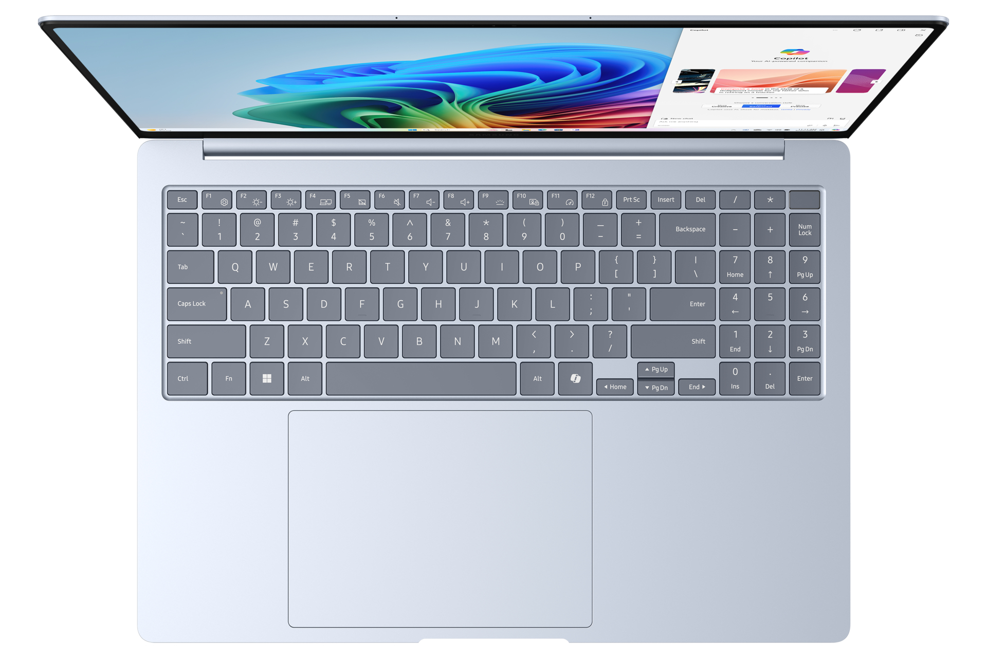 Zilveren laptop, bovenaanzicht, open. Het scherm toont een kleurrijk display.
