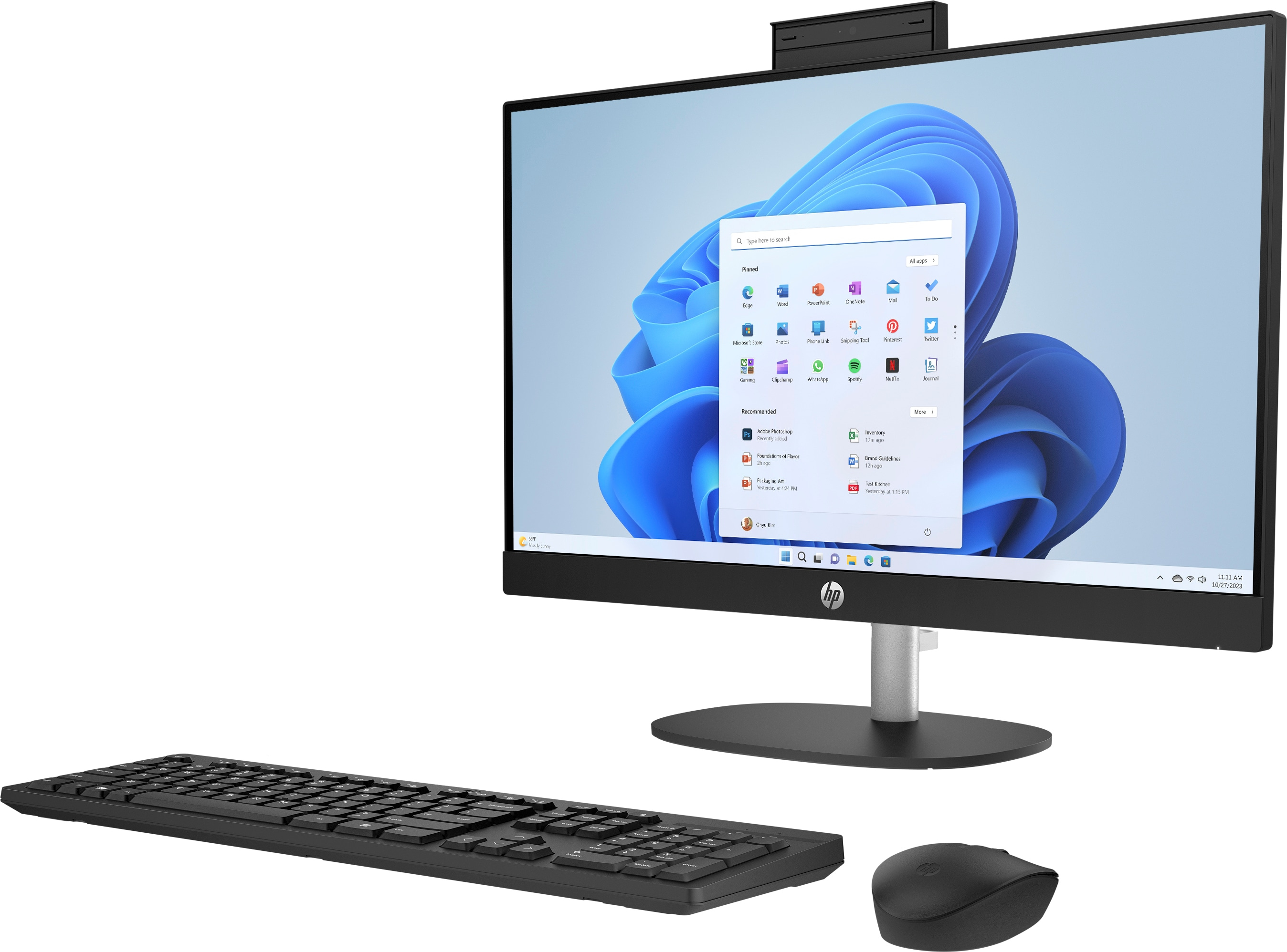 HP all-in-one computer, front view, with keyboard, mouse, and Windows desktop.