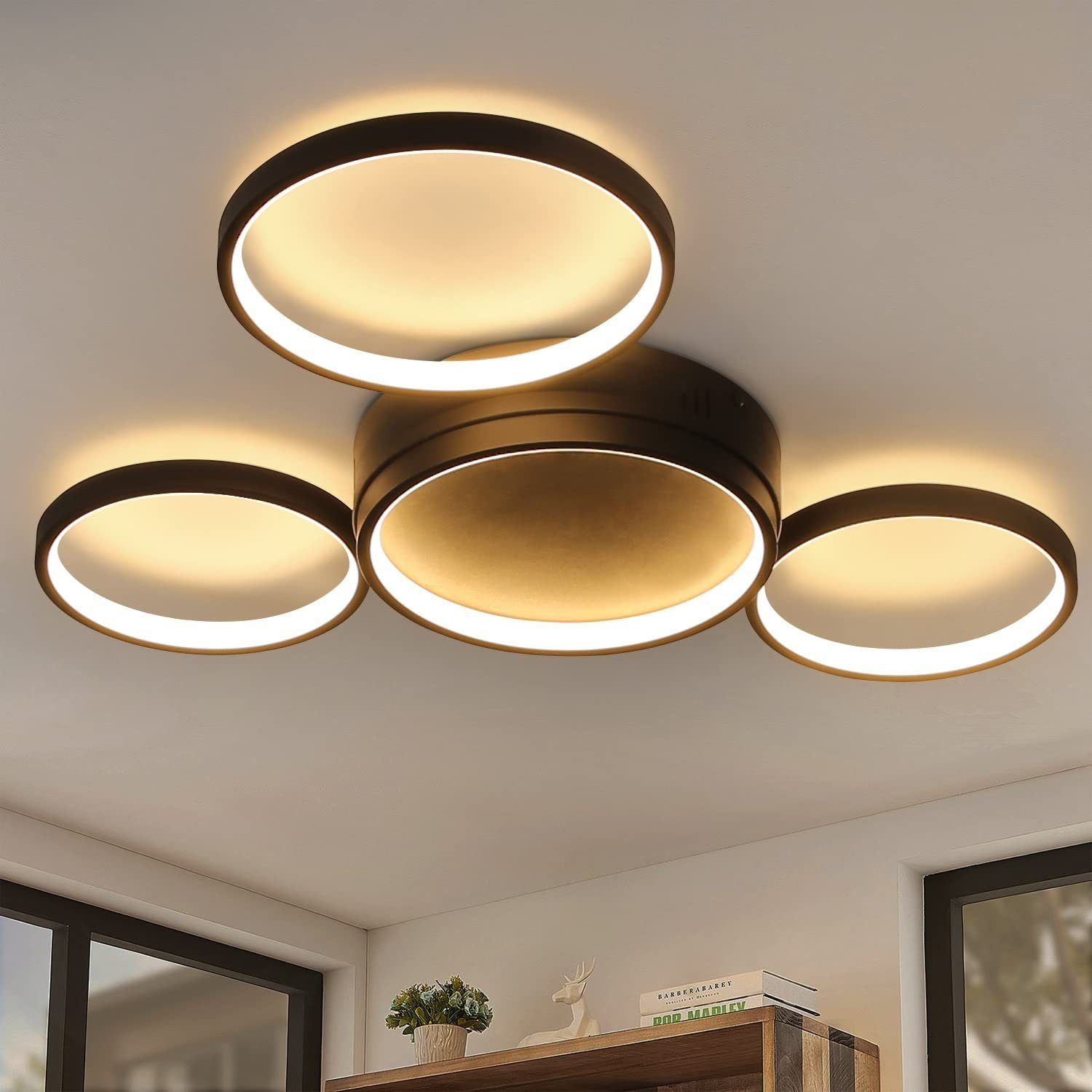 Moderne Deckenleuchten im Wohnzimmer mit dunklem, kreisförmigem Design.