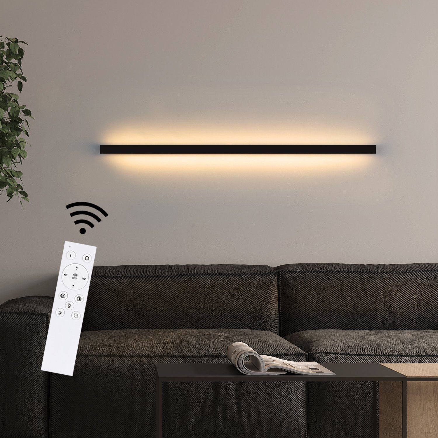 Una striscia luminosa a LED nera montata su un muro. Un telecomando bianco in primo piano.