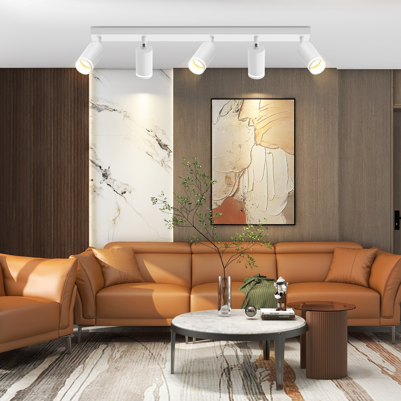 Un soggiorno con divano marrone, tavolino e quadro sopra. Ha uno stile moderno.