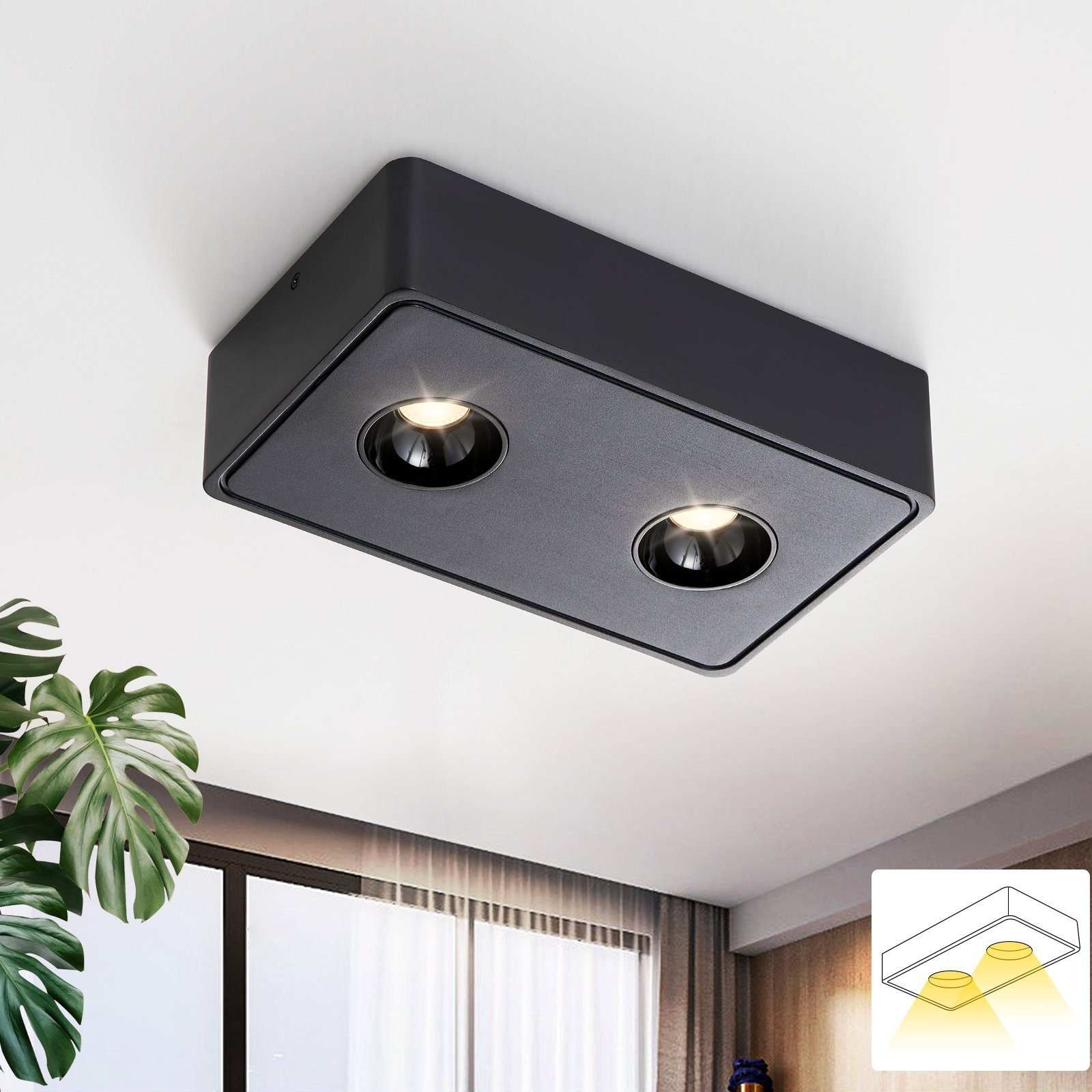 Apparecchio di illuminazione a soffitto rettangolare nero con due luci a incasso. Mostrato contro soffitto bianco.