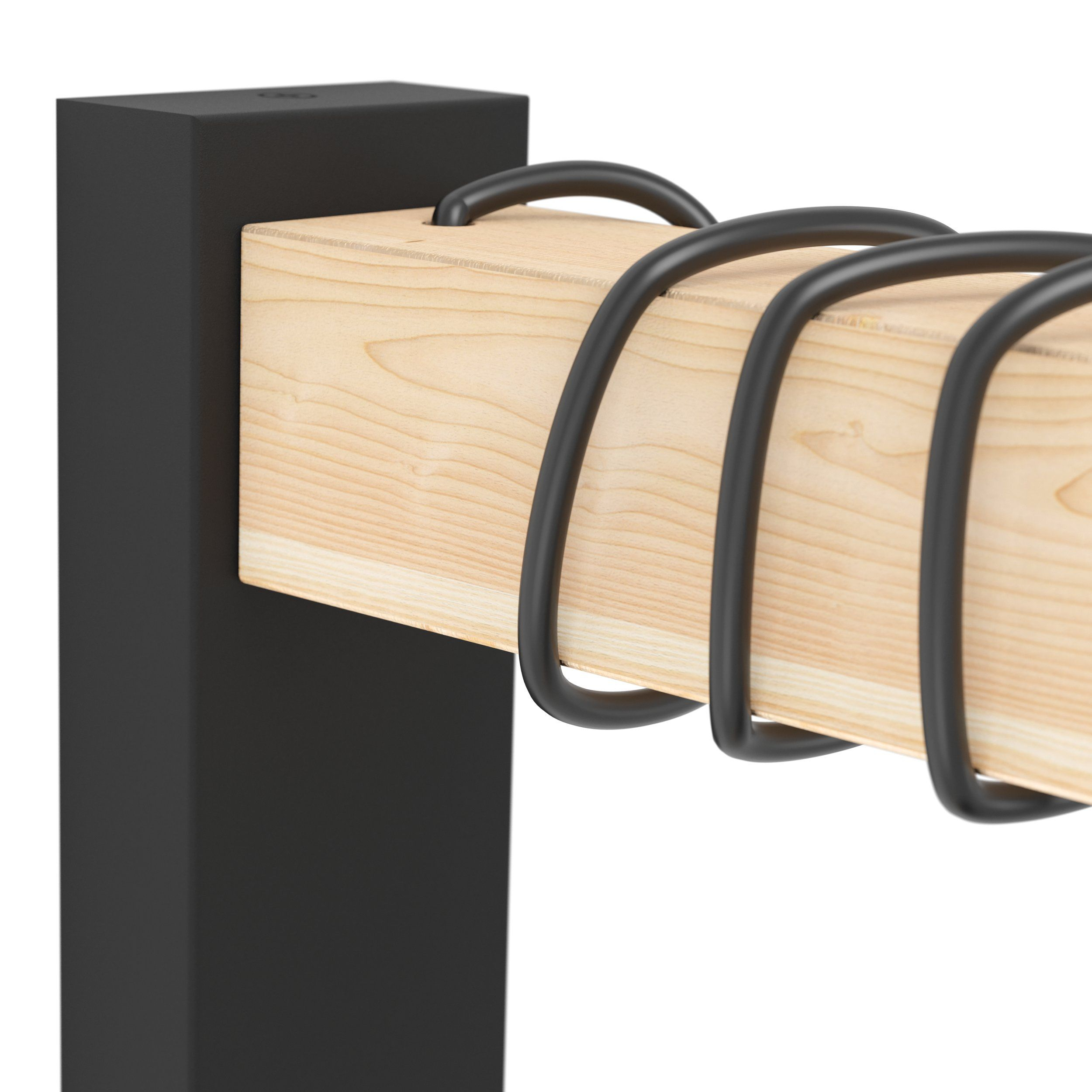 Primo piano di una trave in legno tenuta da un palo nero con barre nere ricurve avvolte attorno.