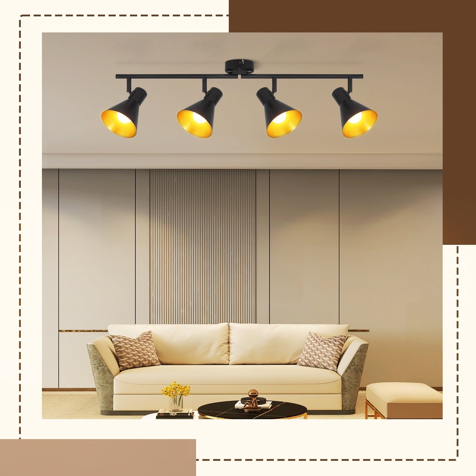 Una stanza con un divano e quattro faretti neri sul soffitto. I faretti illuminano verso il basso.