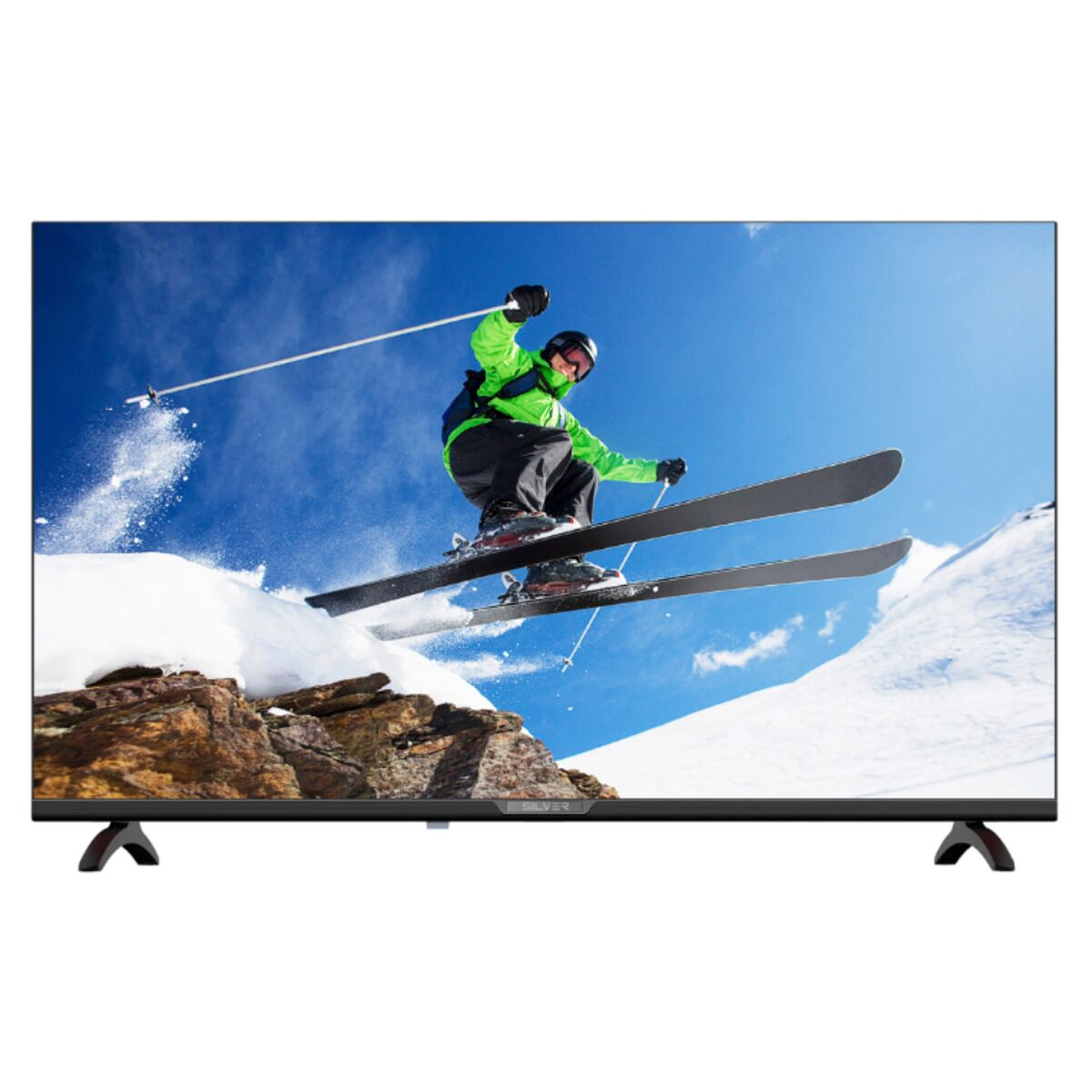 TV che mostra uno sciatore con giacca verde, che scia su una pista innevata.