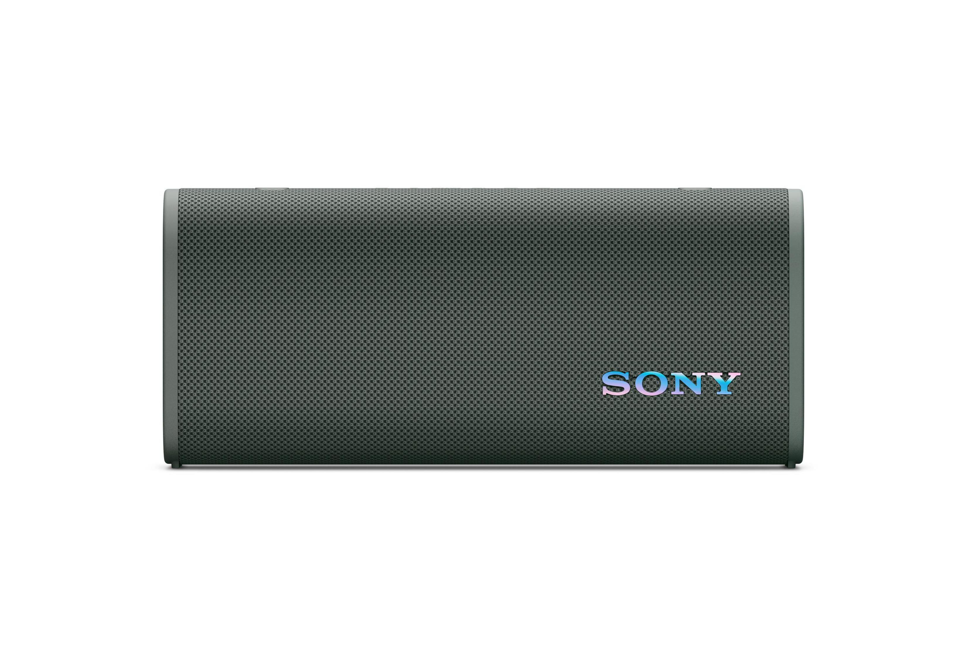 Parte trasera de un televisor LG negro, con puertos y soporte. Fondo neutro.