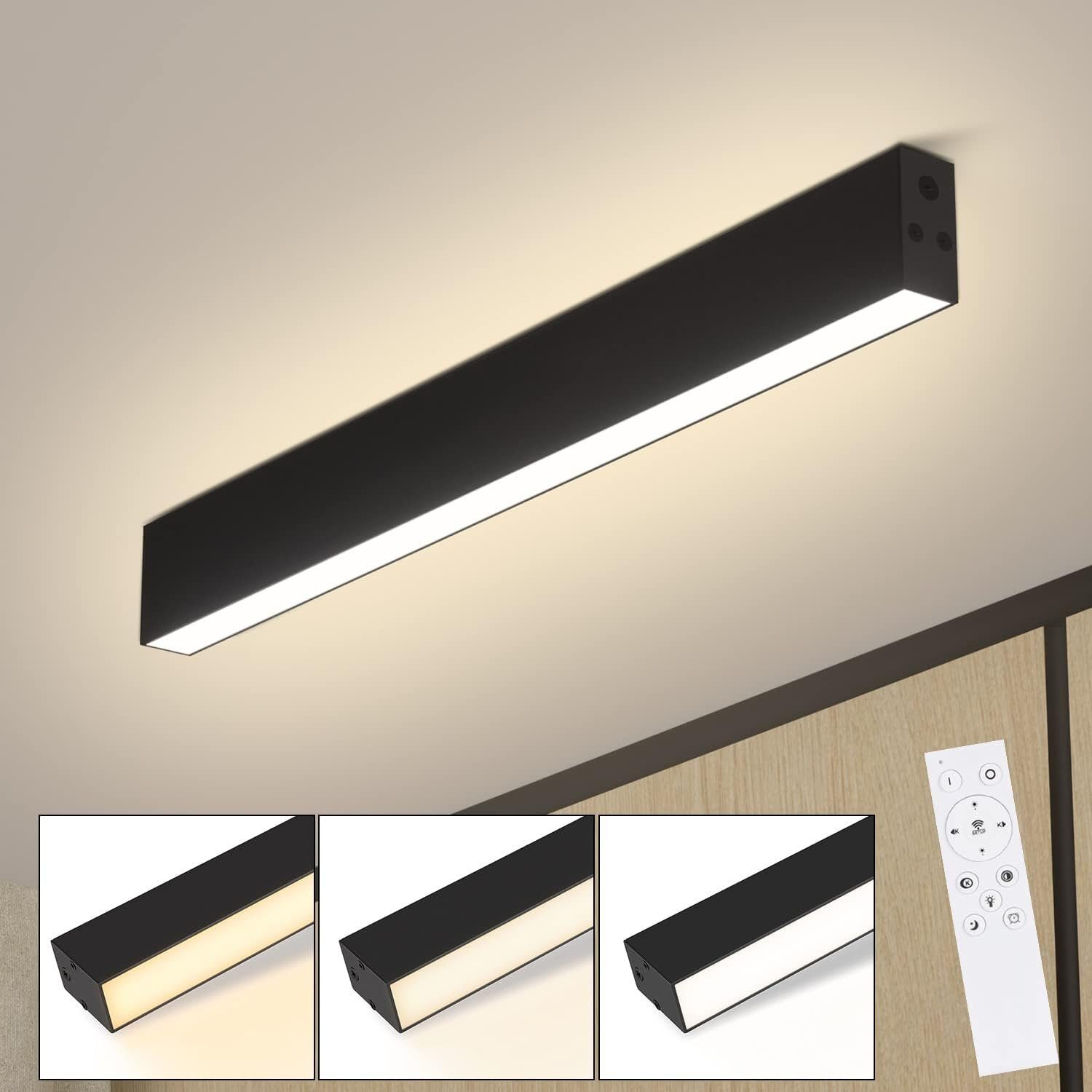 Schwarze, lange, rechteckige Leuchte an einer Decke, mit drei verschiedenen Lichteinstellungen.