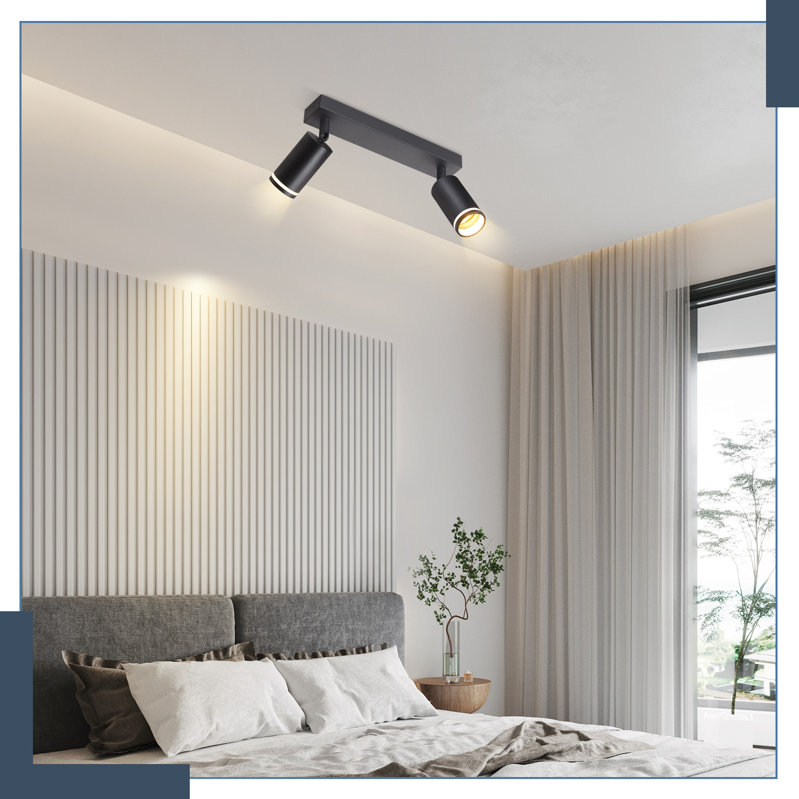 Camera da letto con letto, pareti bianche e faretti neri.