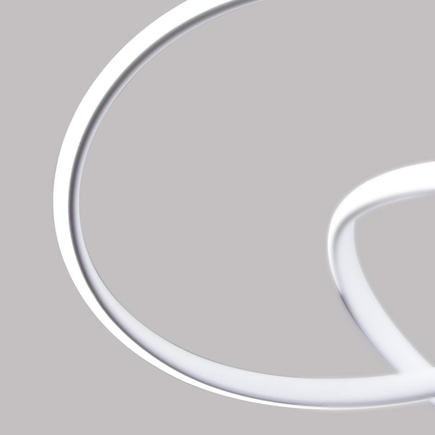 Primer plano de una lámpara blanca, en bucle y moderna. Diseño circular sobre fondo gris.