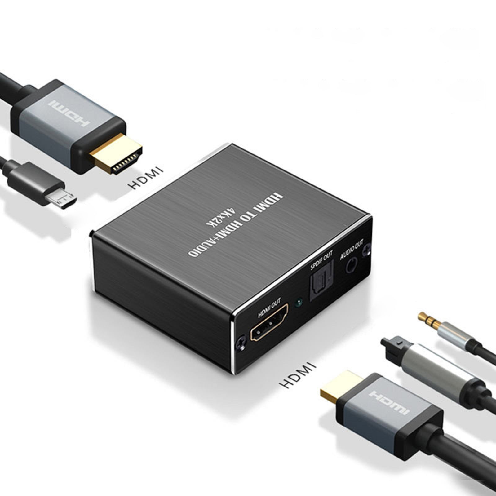 Ein HDMI-zu-HDMI-Audio-Konverter mit mehreren angeschlossenen Kabeln. Der Hintergrund ist weiß.