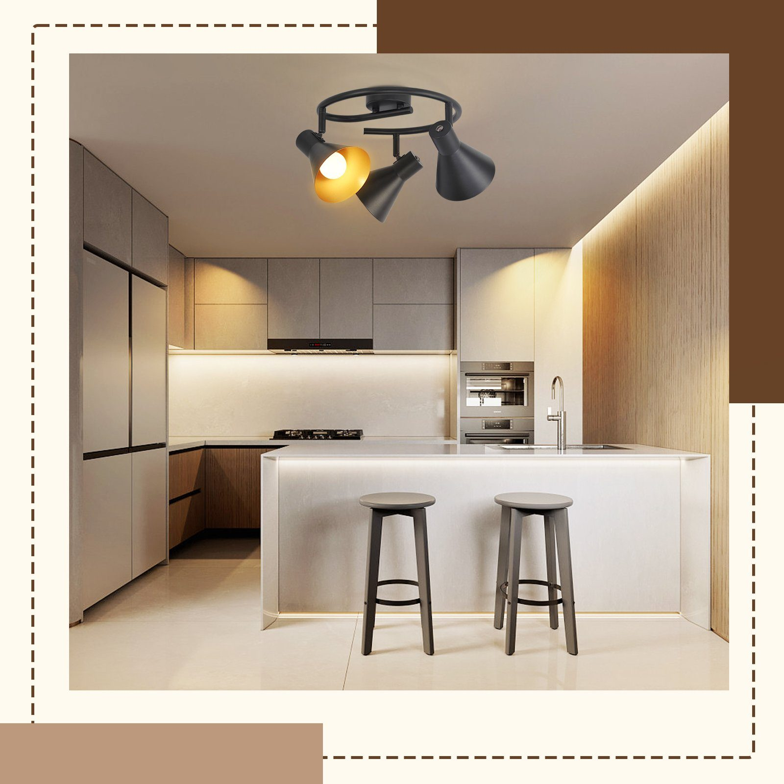 Una cucina con un faretto nero a soffitto con tre luci, sopra un'isola con sgabelli.