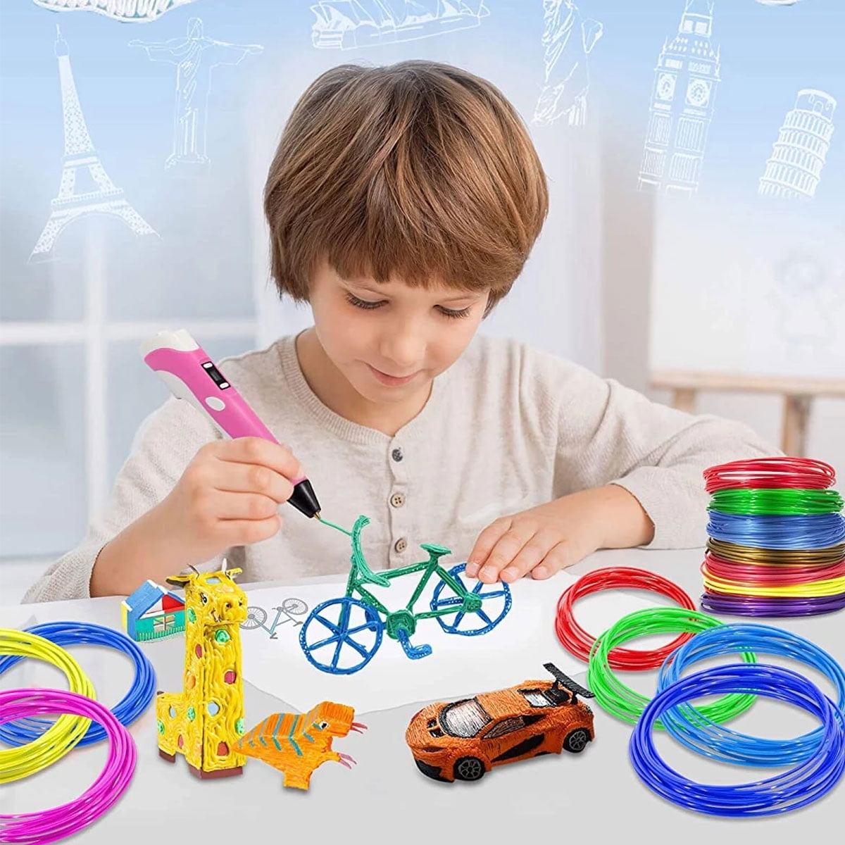Ein Junge benutzt einen 3D-Stift, um Zeichnungen mit verschiedenen Farben von Filament zu erstellen.