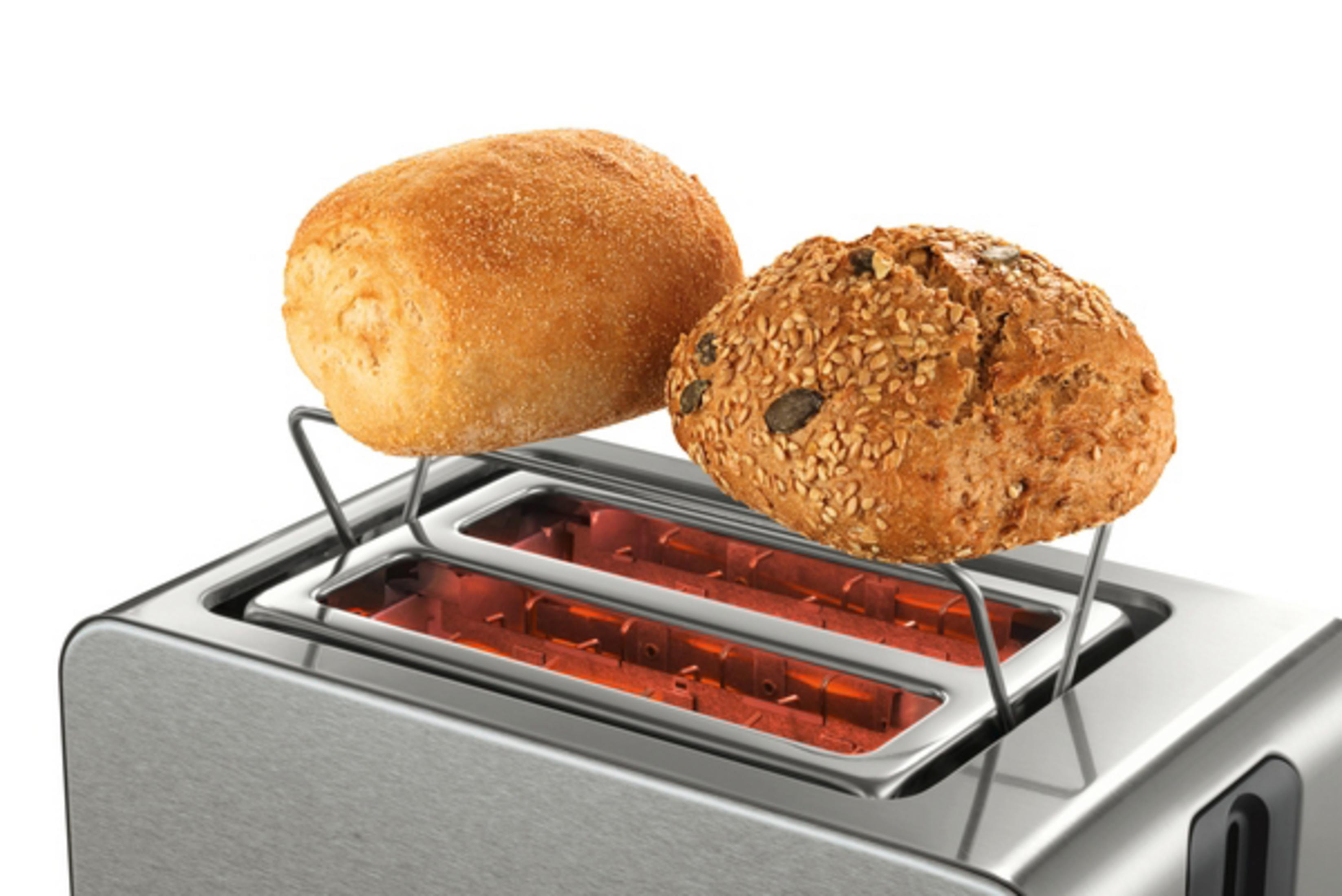 Toster z dwoma tostowanymi bułkami, siedzącymi na drucianym stojaku.