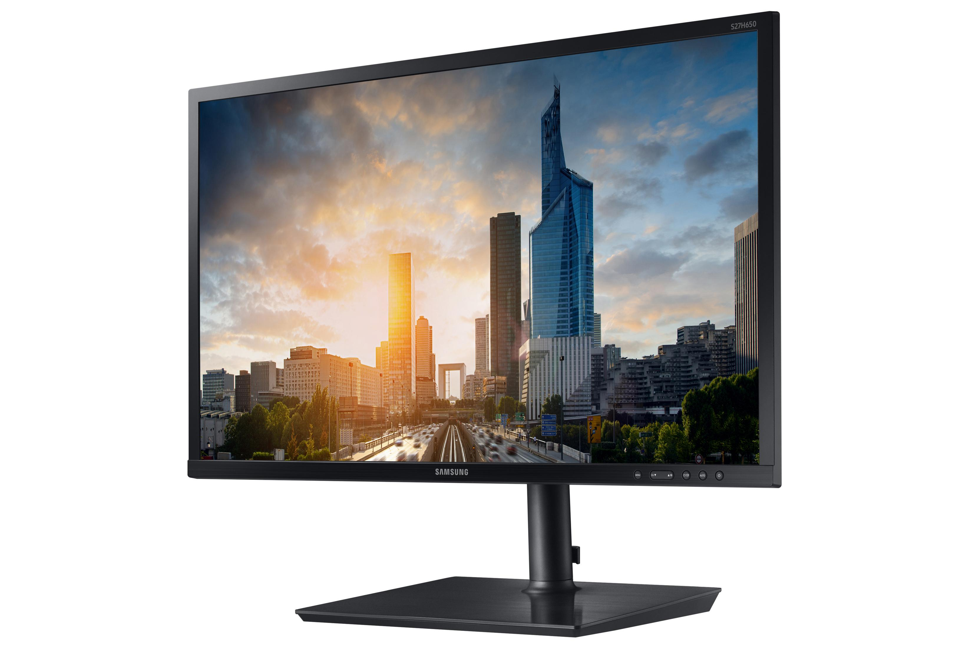 Samsung Monitor zeigt Stadtbild mit blauem Himmel.