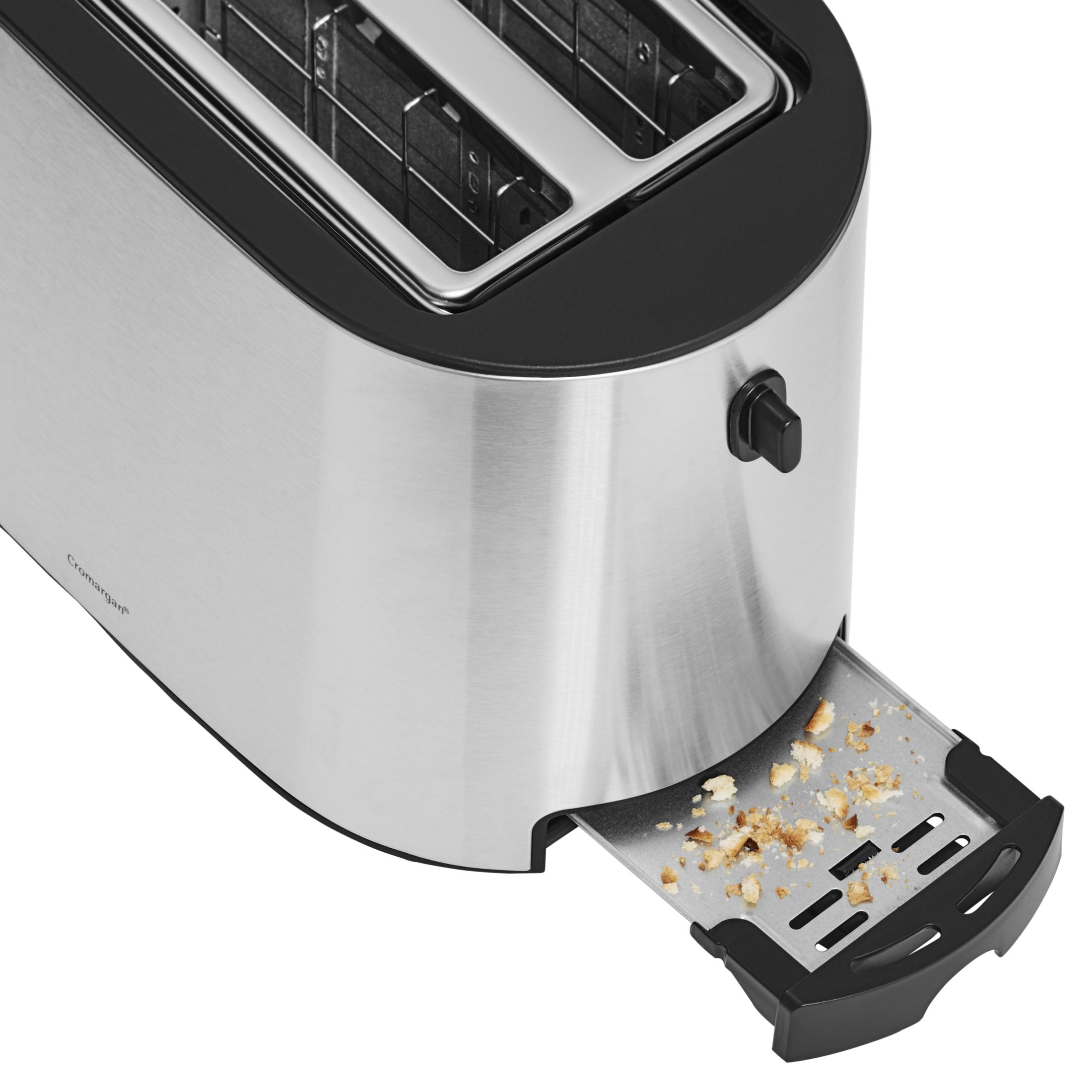 Zbliżenie tostera ze stali nierdzewnej z częściowo wysuniętą tacką na okruchy.