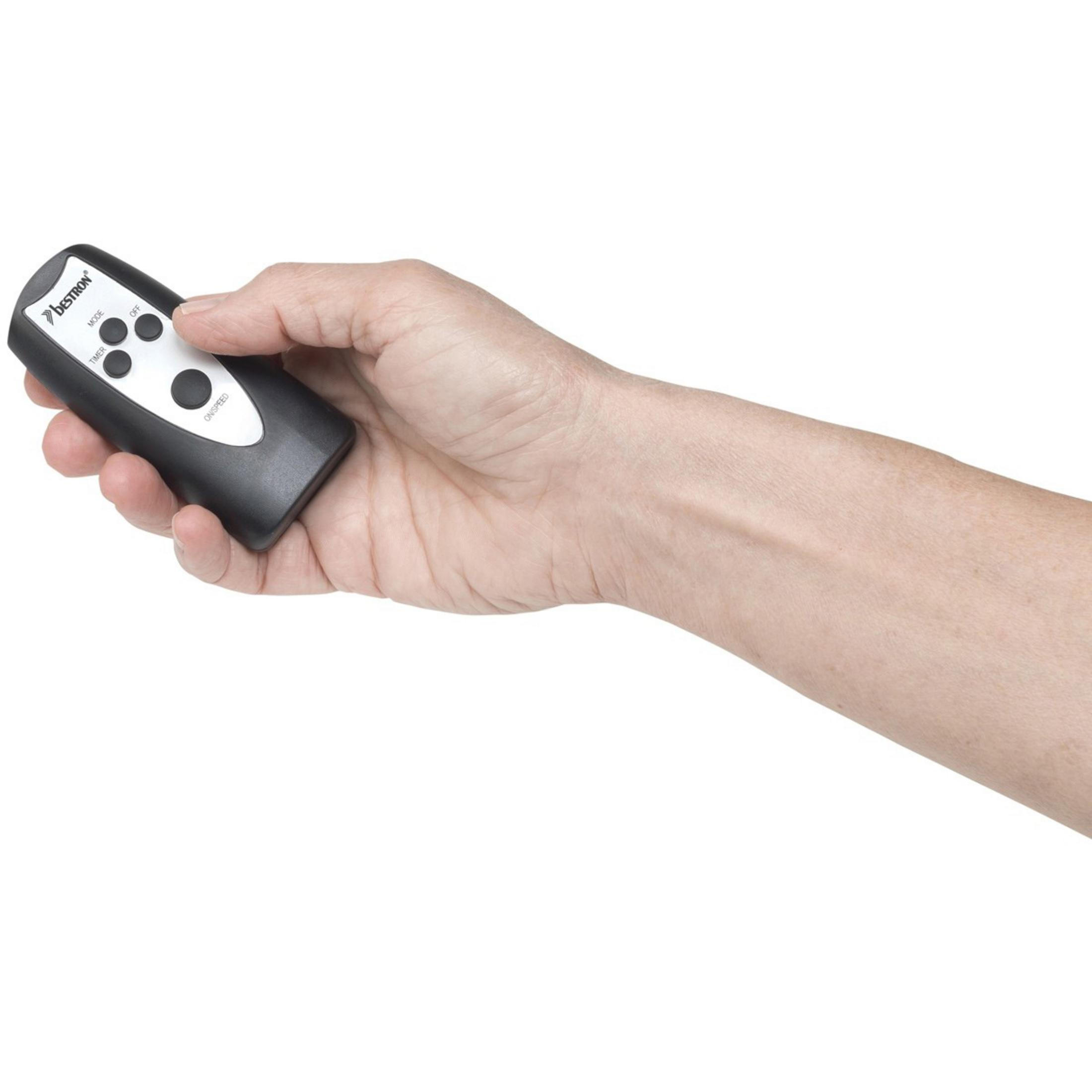 Dłoń trzymająca czarny pilot z przyciskami oznaczonymi 'TEMP', 'MODE' i 'COUNTER'.