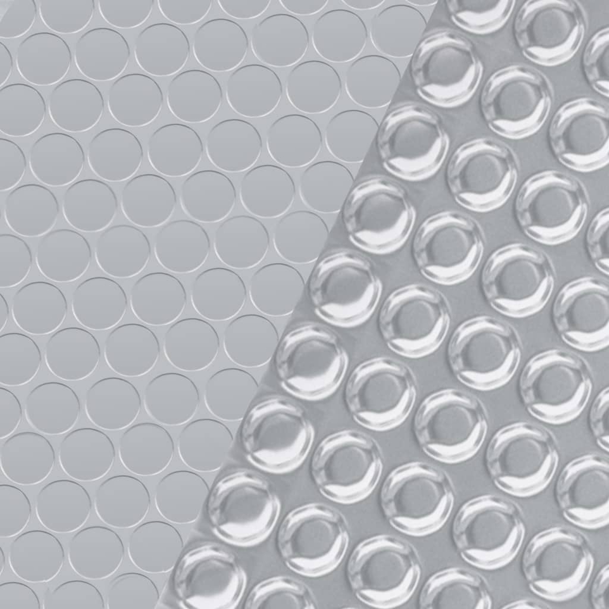 Nahaufnahme eines grauen Luftpolstermaterials. Die Folie hat kleine, gleichmäßig verteilte, klare Blasen.