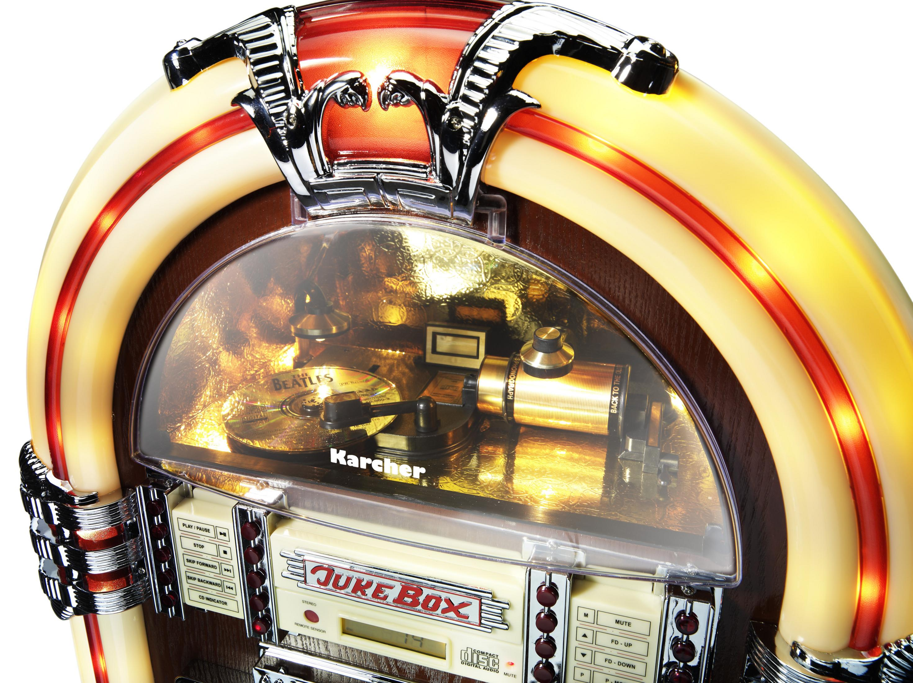 Eine Vintage-Jukebox mit transparenter Front. Sie spielt eine Schallplatte mit dem Wort Beatles darauf.