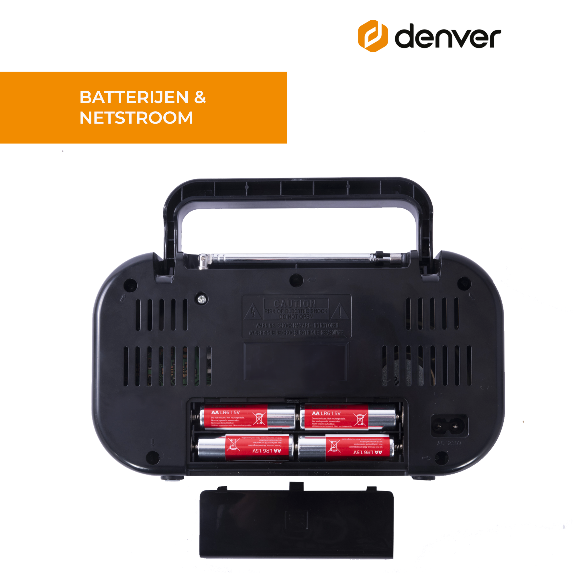 Tył czarnego radia z widocznymi bateriami, przegródką i etykietą ostrzegawczą.