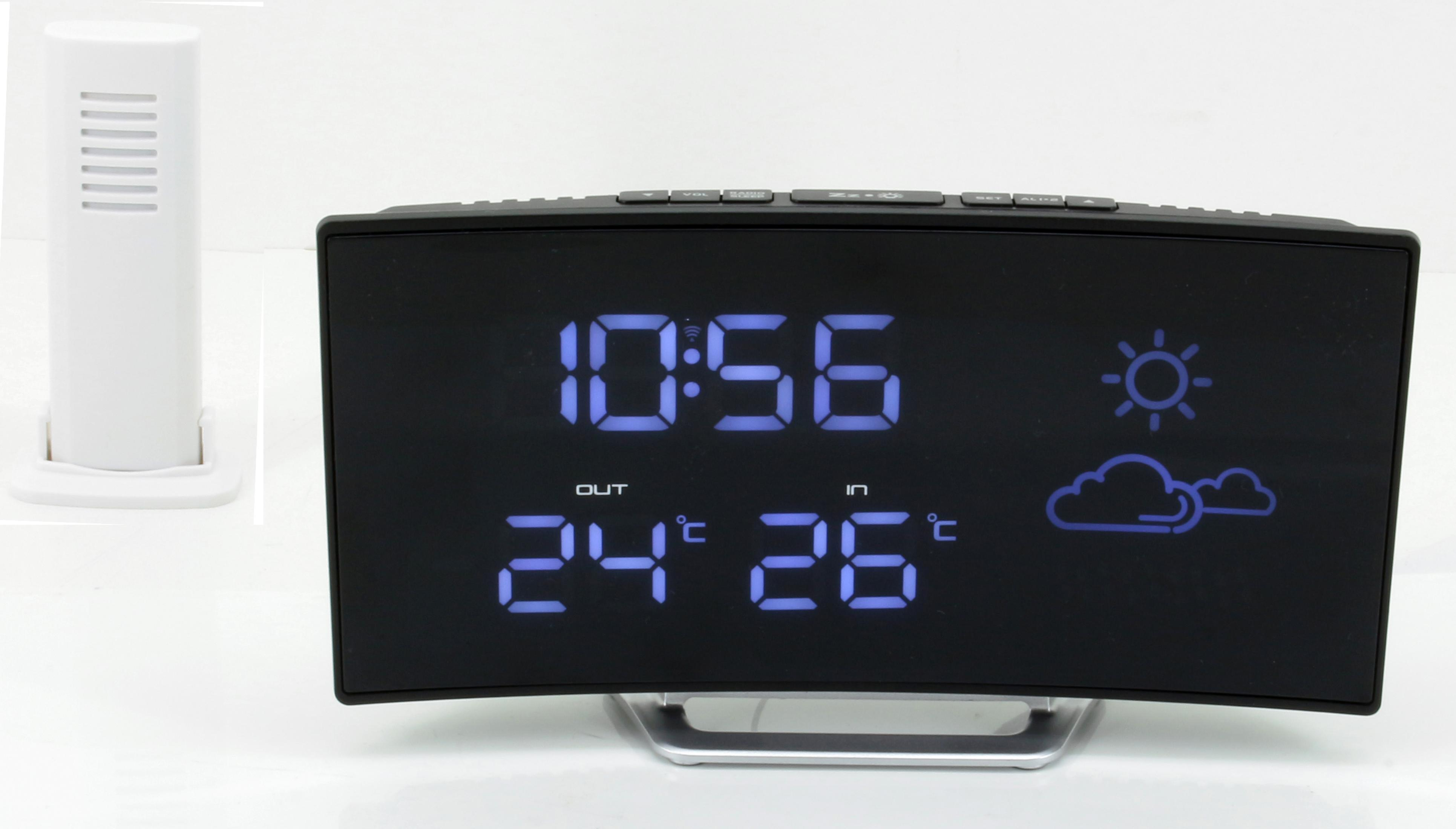Orologio digitale nero curvo che mostra ora e temperatura. Icone meteo sullo schermo. Sensore bianco accanto.