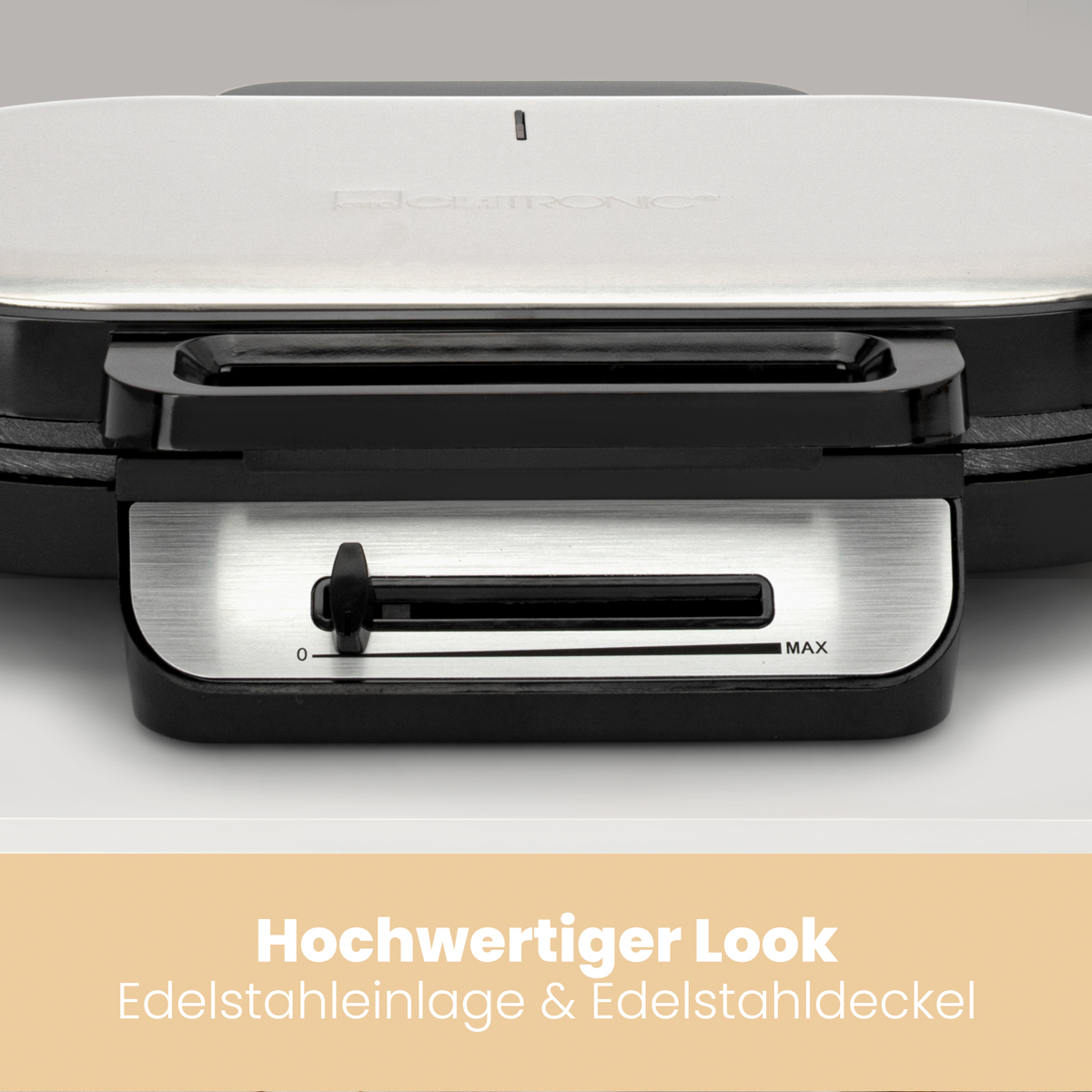 Zbliżenie panelu sterowania czarnej gofrownicy z tekstem.