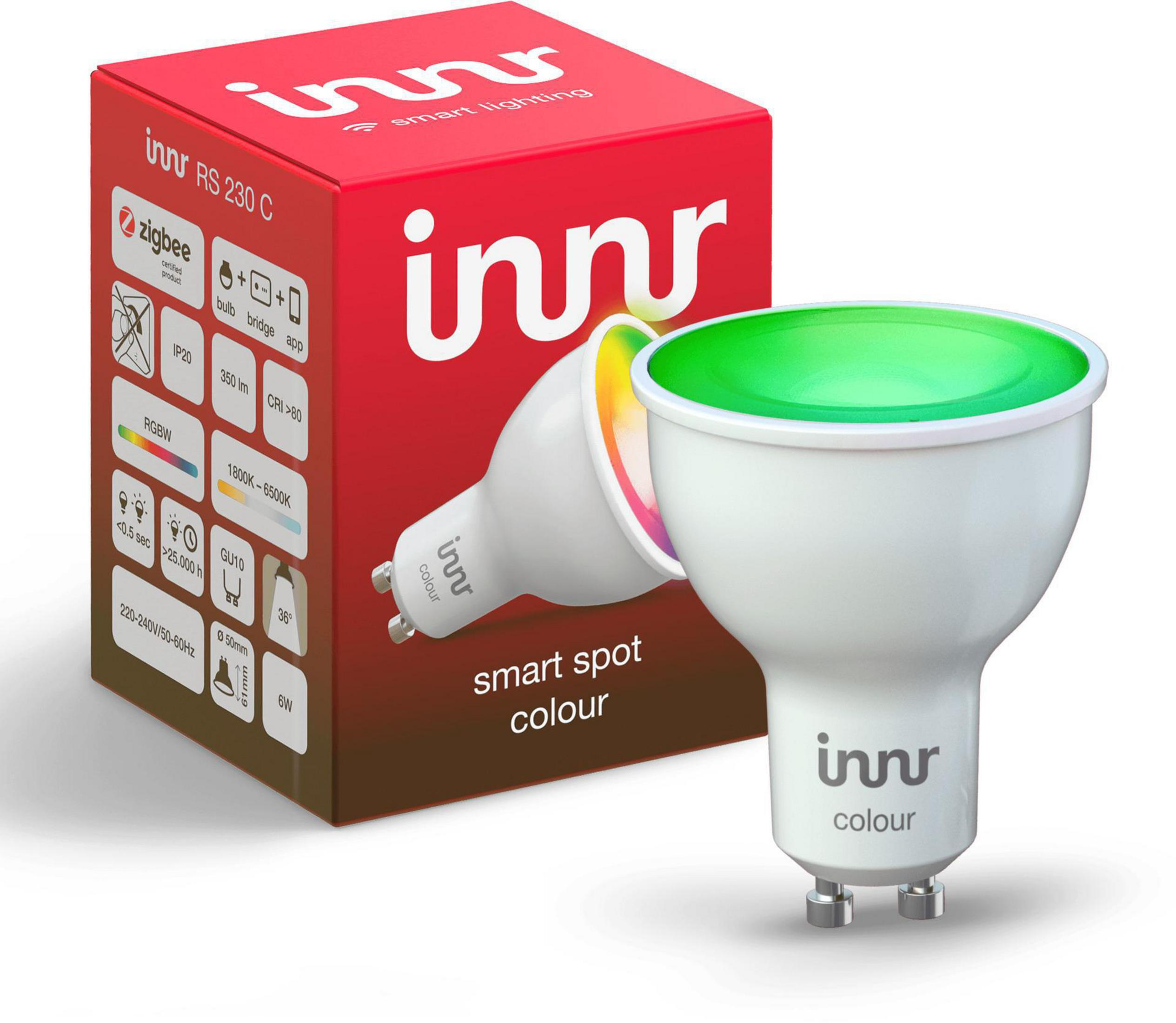 Innr Smart Spot Farb-Glühbirne mit roter Box. Die Glühbirne hat ein weißes Gehäuse und leuchtet grün.