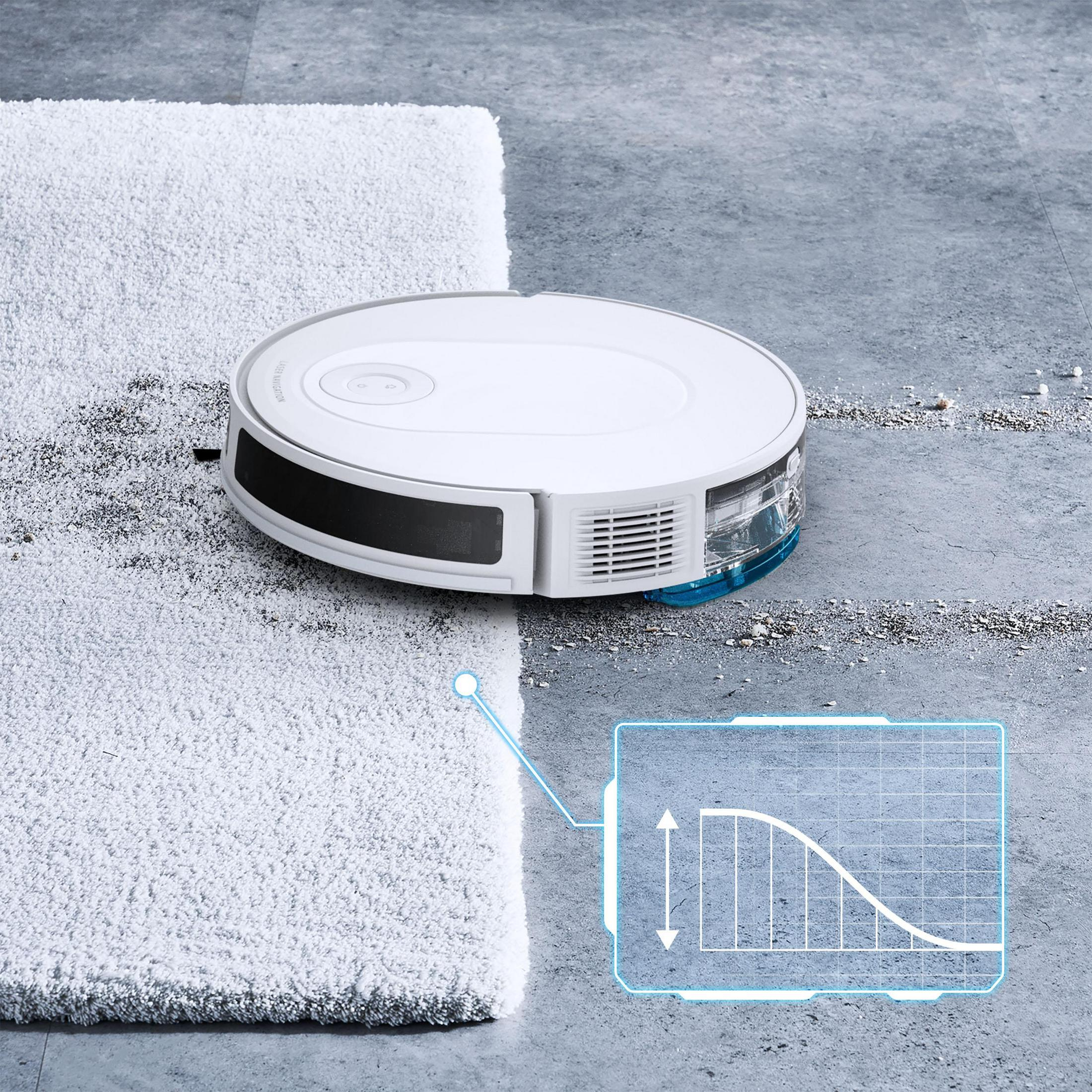 Biały odkurzacz robot sprząta dywan. Wykres wizualizuje ścieżkę czyszczenia. Widoczna betonowa podłoga.